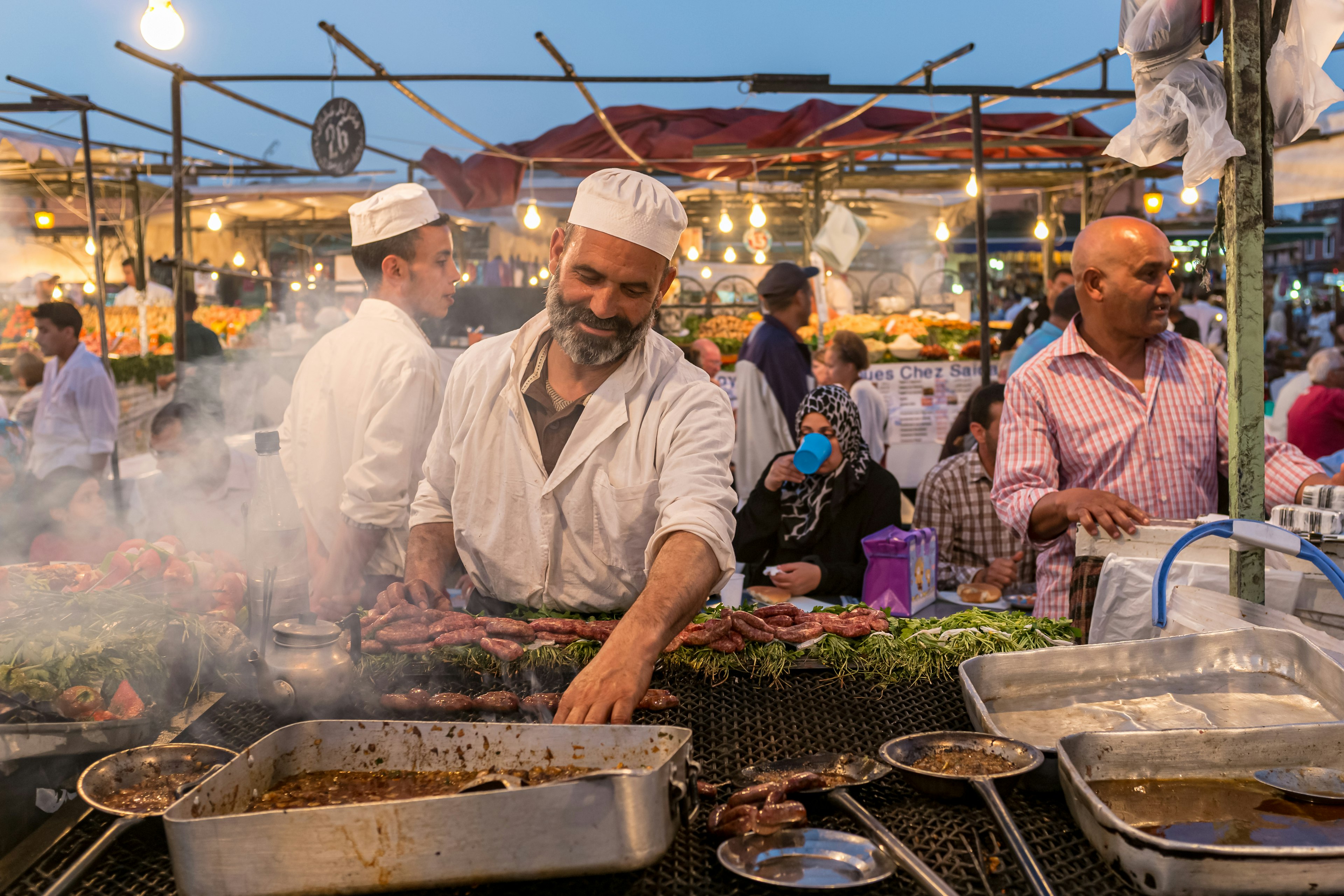 A cook at a food stall in Jemaa el-Fnaa, the main square of Marrakesh, Morocco.