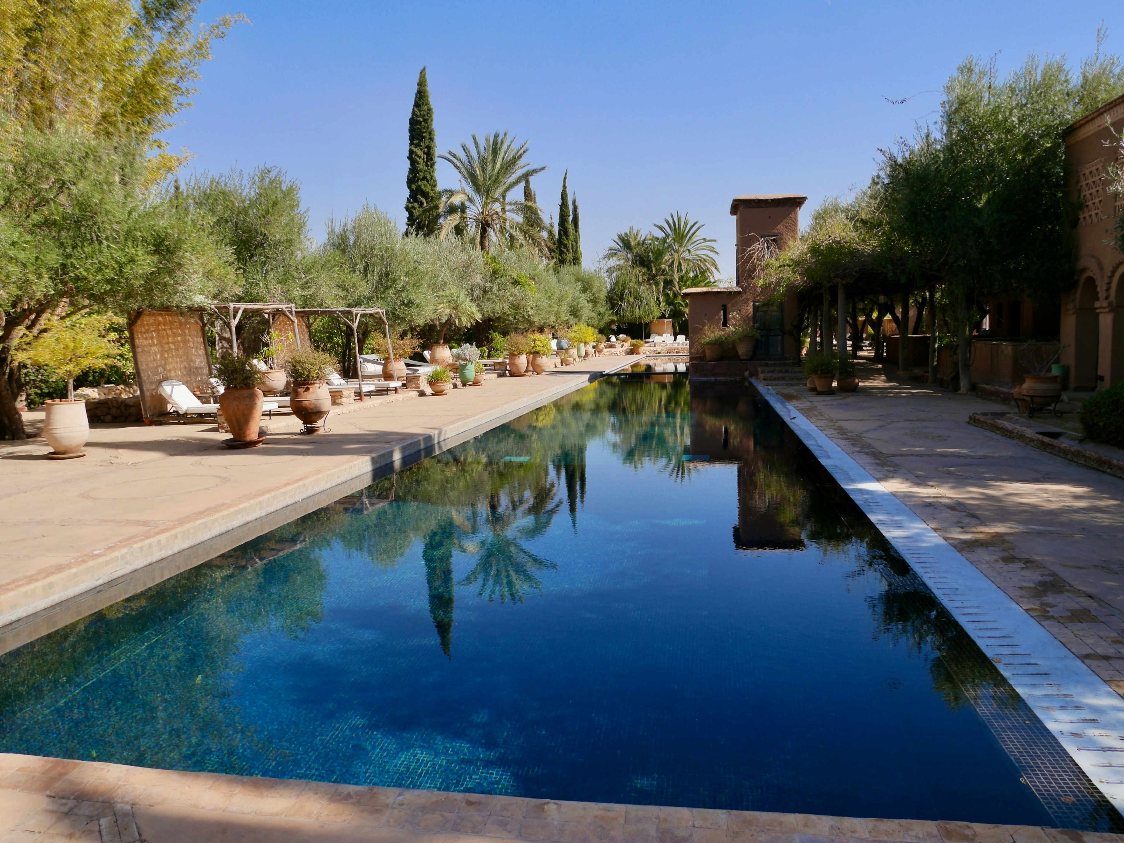 Marrakech, Morocco, 24.01.2020. Beautiful reflecting pool at Beldi Country Club.