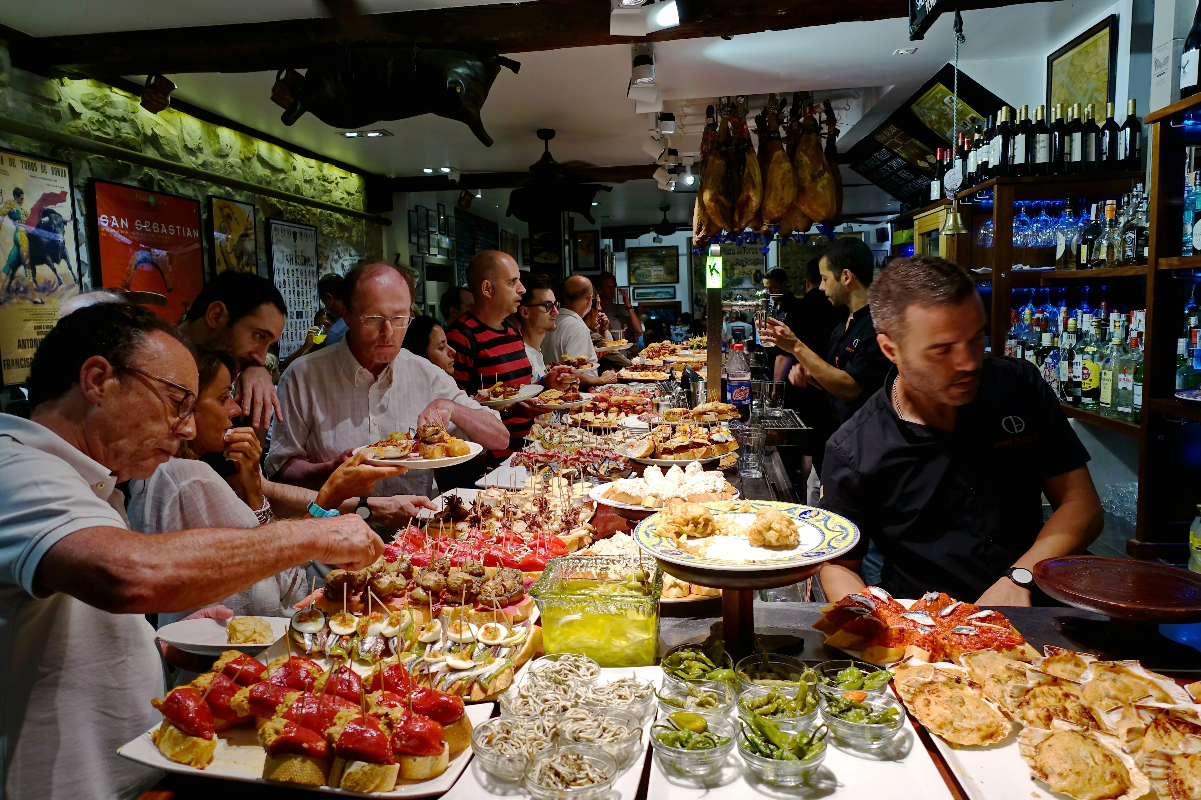 A bar in San Sebastian lined with delicious pintxos, the traditional appetizers of the Basque country.