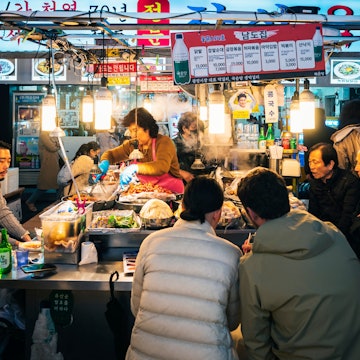 Seoul, South Korea - Apr 14, 2023 : Gwangjang Market traditional street market with people eating at counter Famous market in Seoul License Type: media Download Time: 2024-05-06T06:05:20.000Z User: aomi.ito_lonelyplanet Is Editorial: Yes purchase_order: