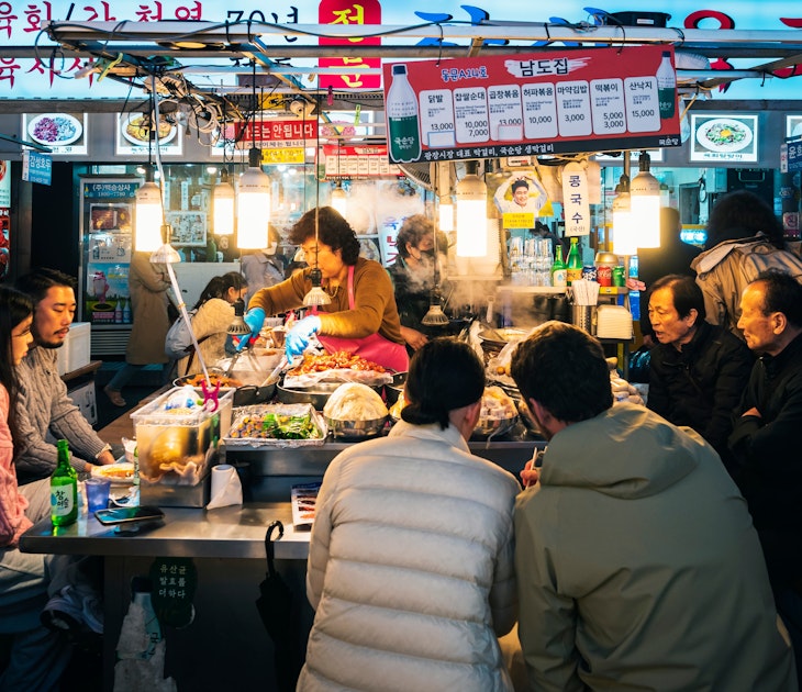 Seoul, South Korea - Apr 14, 2023 : Gwangjang Market traditional street market with people eating at counter Famous market in Seoul  License Type: media  Download Time: 2024-05-06T06:05:20.000Z  User: aomi.ito_lonelyplanet  Is Editorial: Yes  purchase_order:
