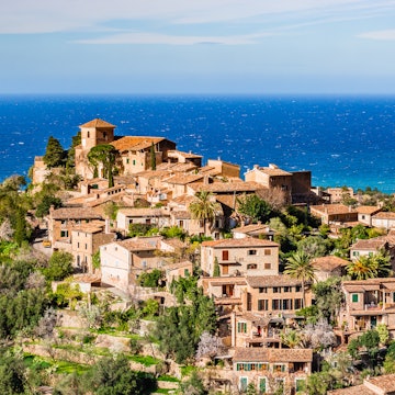 Looking over Deià's honey-coloured houses, which occupy a stunning mountain-top location overlooking the Mediterranean.