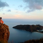 Woman overlooking stunning view over the sea from a rock on a high point in Yasawa, Fiji License Type: media Download Time: 2023-05-23T08:34:03.000Z User: meg3348277 Is Editorial: No purchase_order: