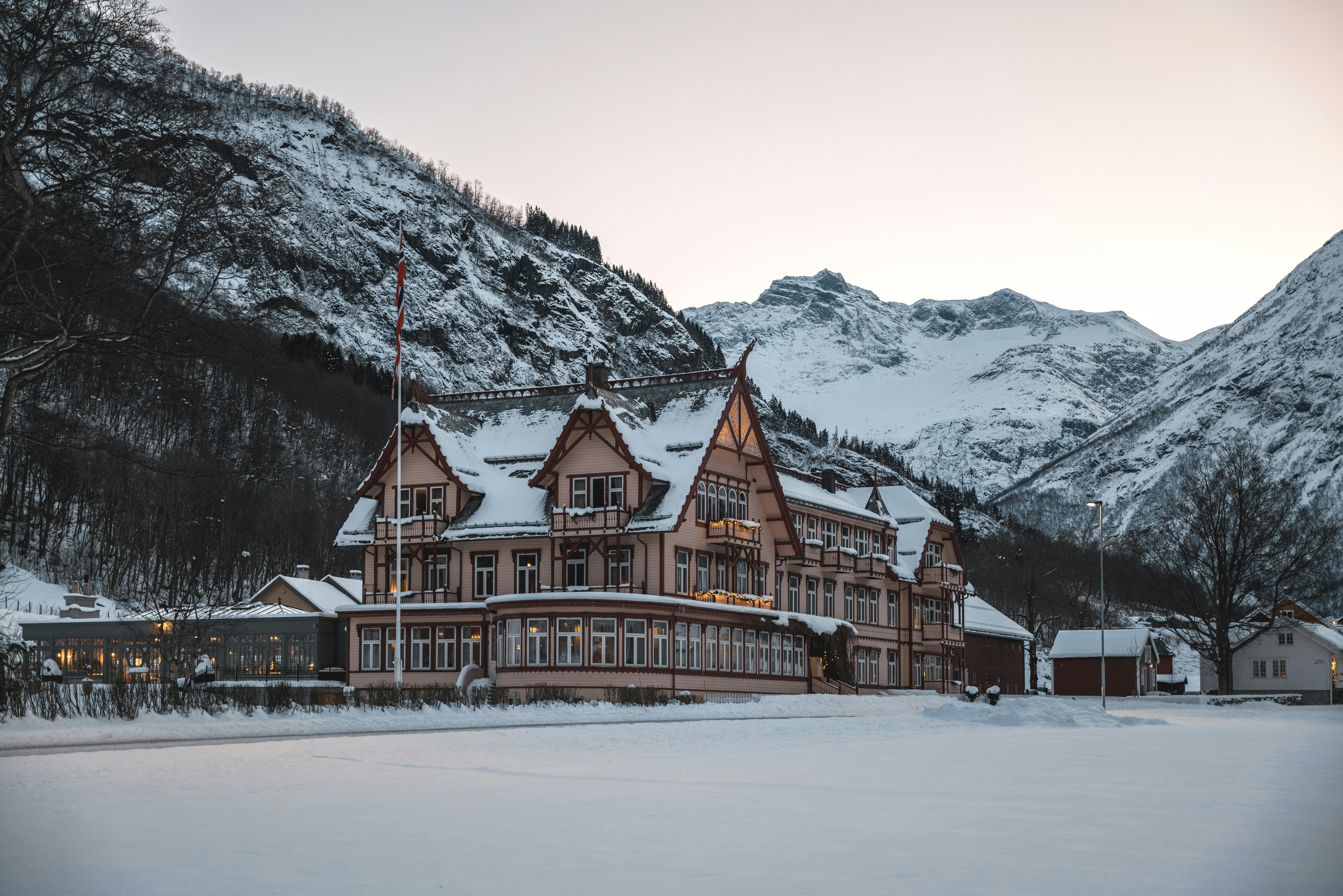 A snow-covered chalet among mountains