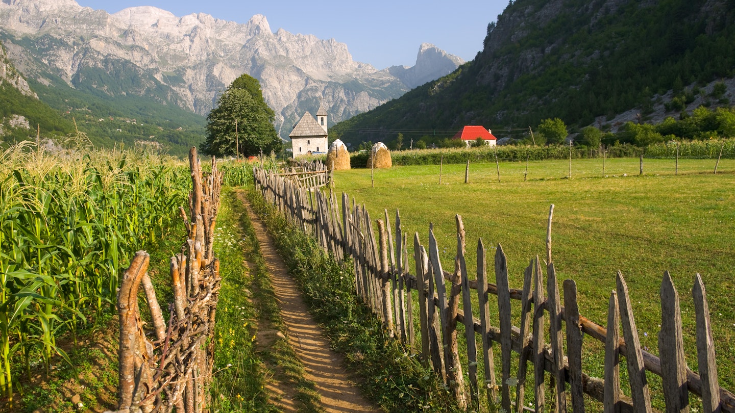 a path with wooden fence leads the catholic church in the Theth Valley, on background the mountains of Albanian Alps
112681157
cursed,albania,footrail,trees,scene,path,trail,mountain,view,landmark,nobody,scenics,sky,sightseeing,woods,mount,field,theth,valley,thethi,forest,alps,dinaric,accursed,church,scenery,prokletije,grass,national,perspective,track,europe,park,famous,green,balkans,highlands,nature,clear,albanian,belltower,peak,flower,eastern europe,blue,wooden,pathway,fence,landscape
Licensed for Best in Travel 2024