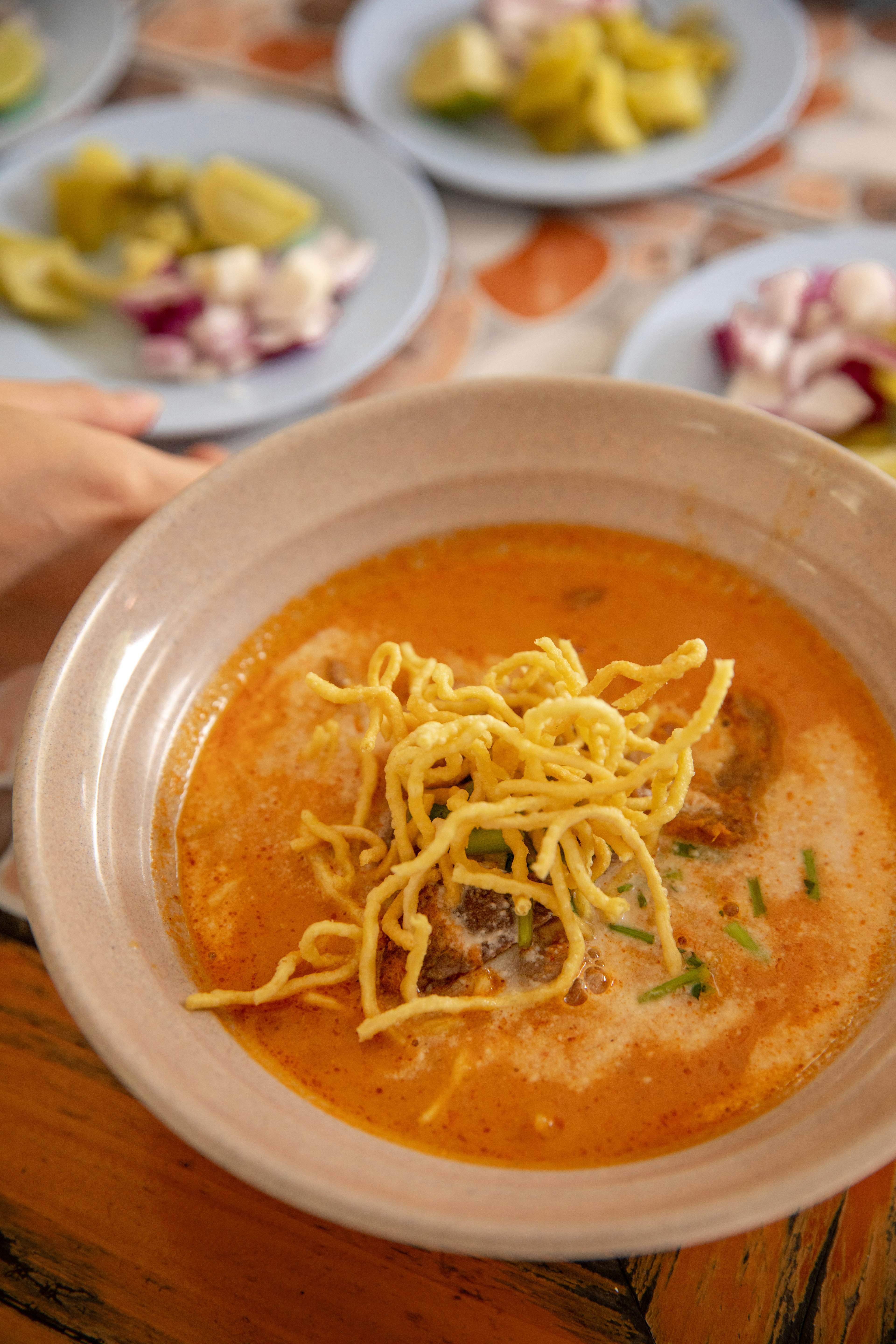 A bowl of kow soy, wheat noodles in a curry broth, Chiang Mai.