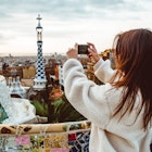 Barcelona signature style. modern tourist woman in coat at Guell Park in Barcelona, Spain looking into the distance; Shutterstock ID 1384104731; purchase_order:65050 - Digital Destinations and Articles; job:Online editorial; client:Spain phone connection; other:Claire Naylor
1384104731
