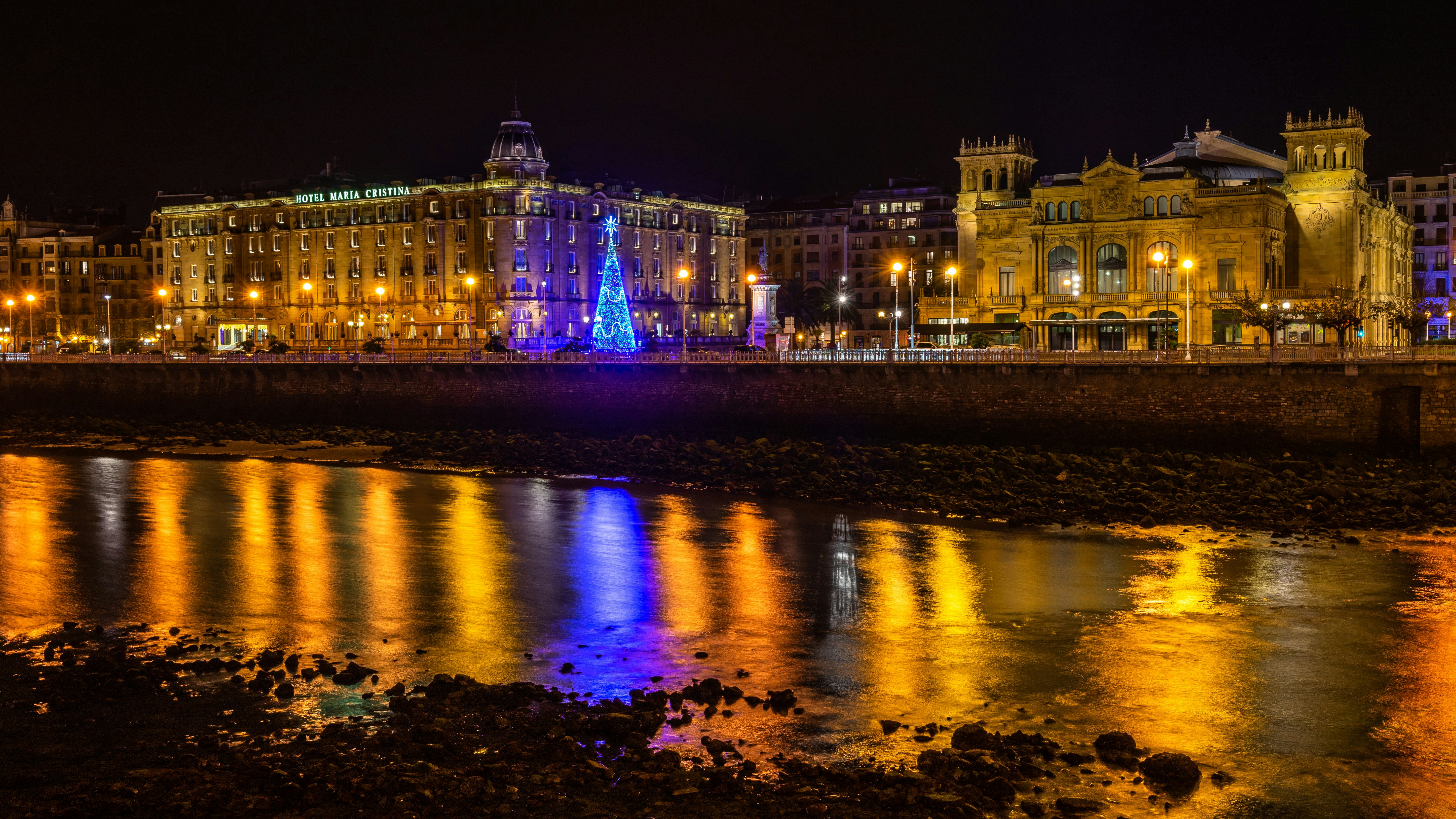 San Sebastian night cityscape with two of the most elegant buildings of the city: Victoria Eugenia Theater and Hotel Maria Cristina.