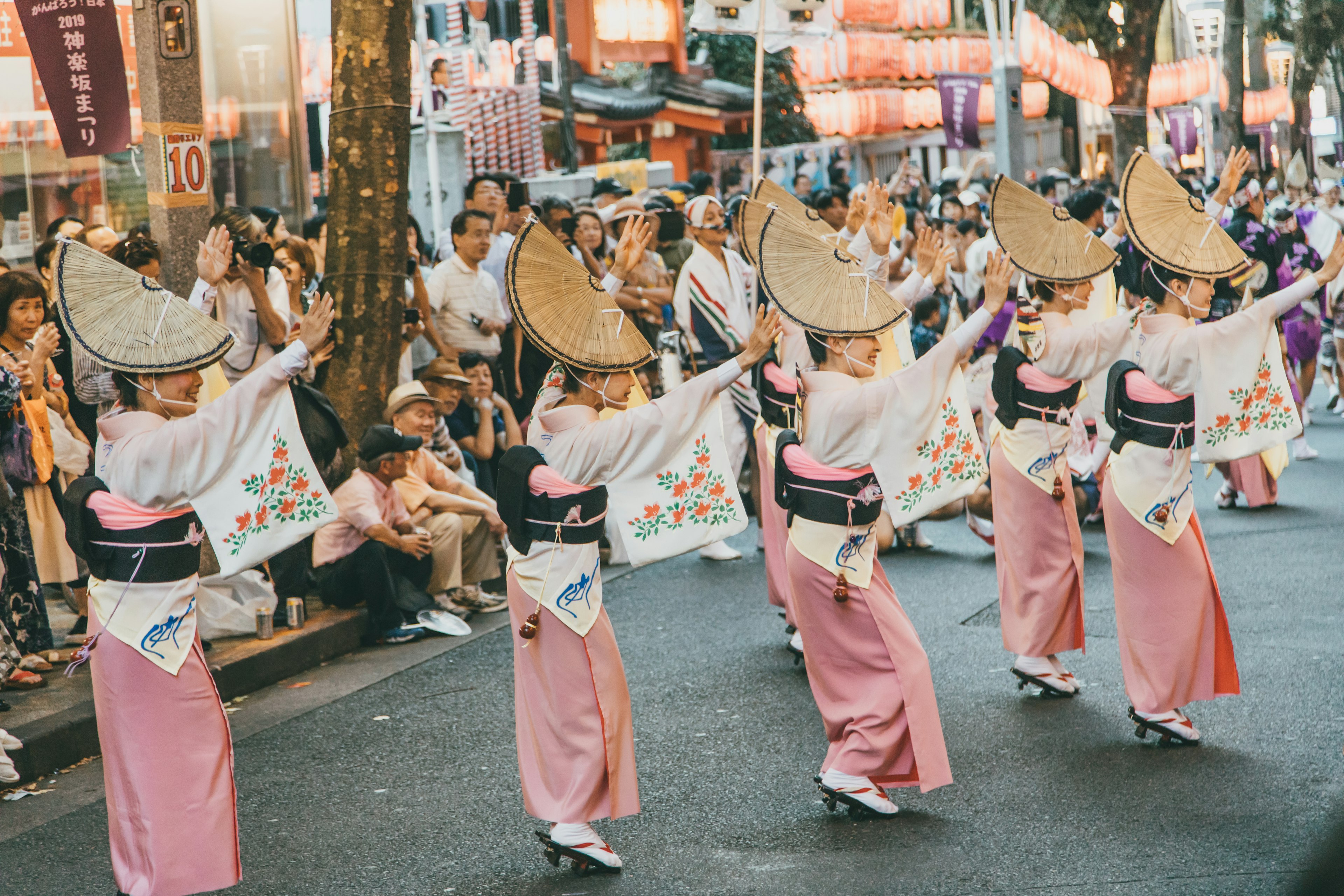 Tokyo summer - Performers dressed in pink and white parade as part of Koenji's Awa Odori festival