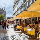 Lisbon, Portugal - July, 24th, 2018 : People sit outside Café Pastelaria Bénard, a traditional  Pastry-Shop first opened in 1868 in the Chiado district of Lisbon., License Type: media, Download Time: 2024-09-25T22:16:04.000Z, User: Norma.PrauseBrewer_LonelyPlanet, Editorial: true, purchase_order: 56530, job: Global Publishing WIP, client: Portugal 14, other: Norma Brewer