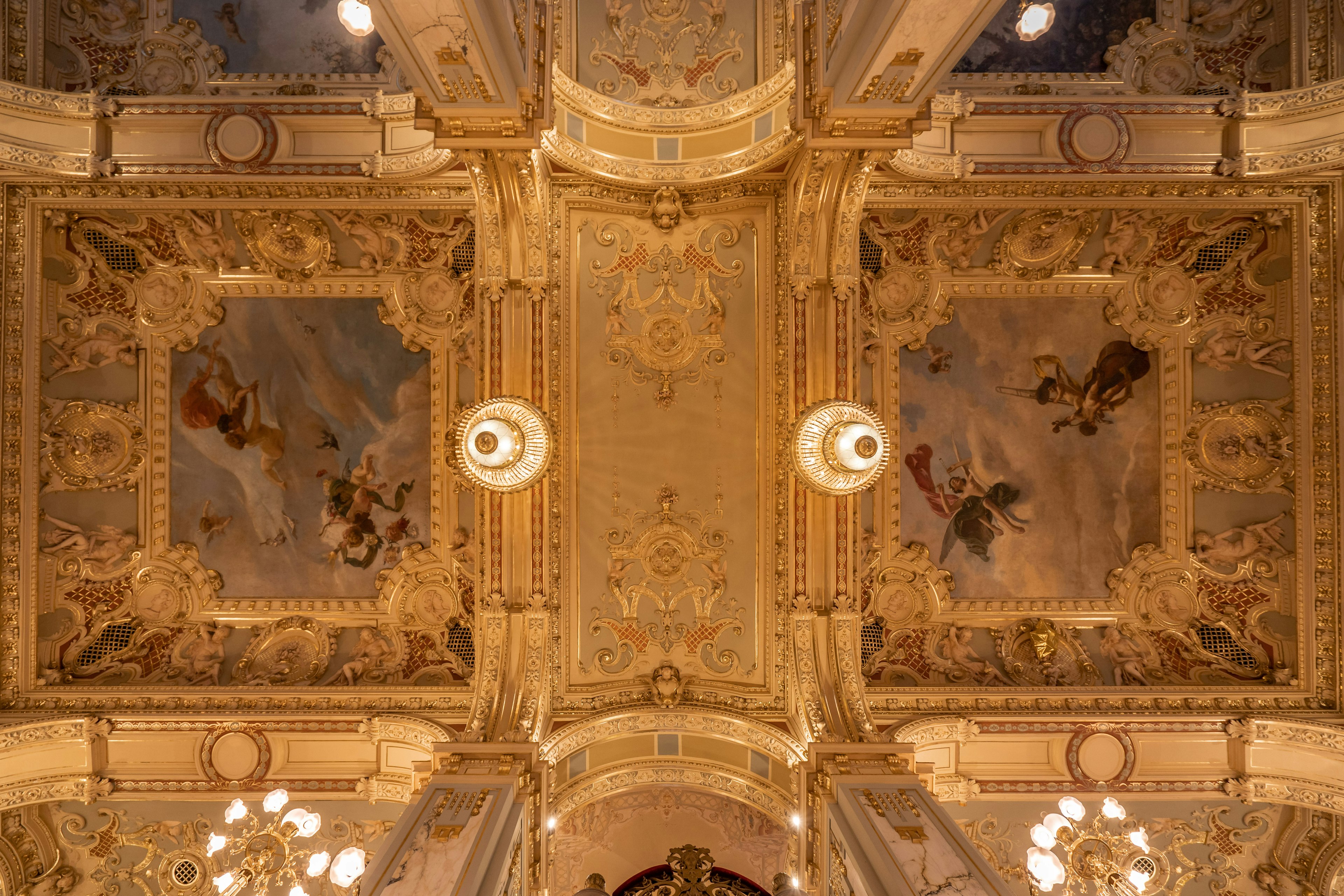 Upward view of ornamental ceiling inside New York Cafe