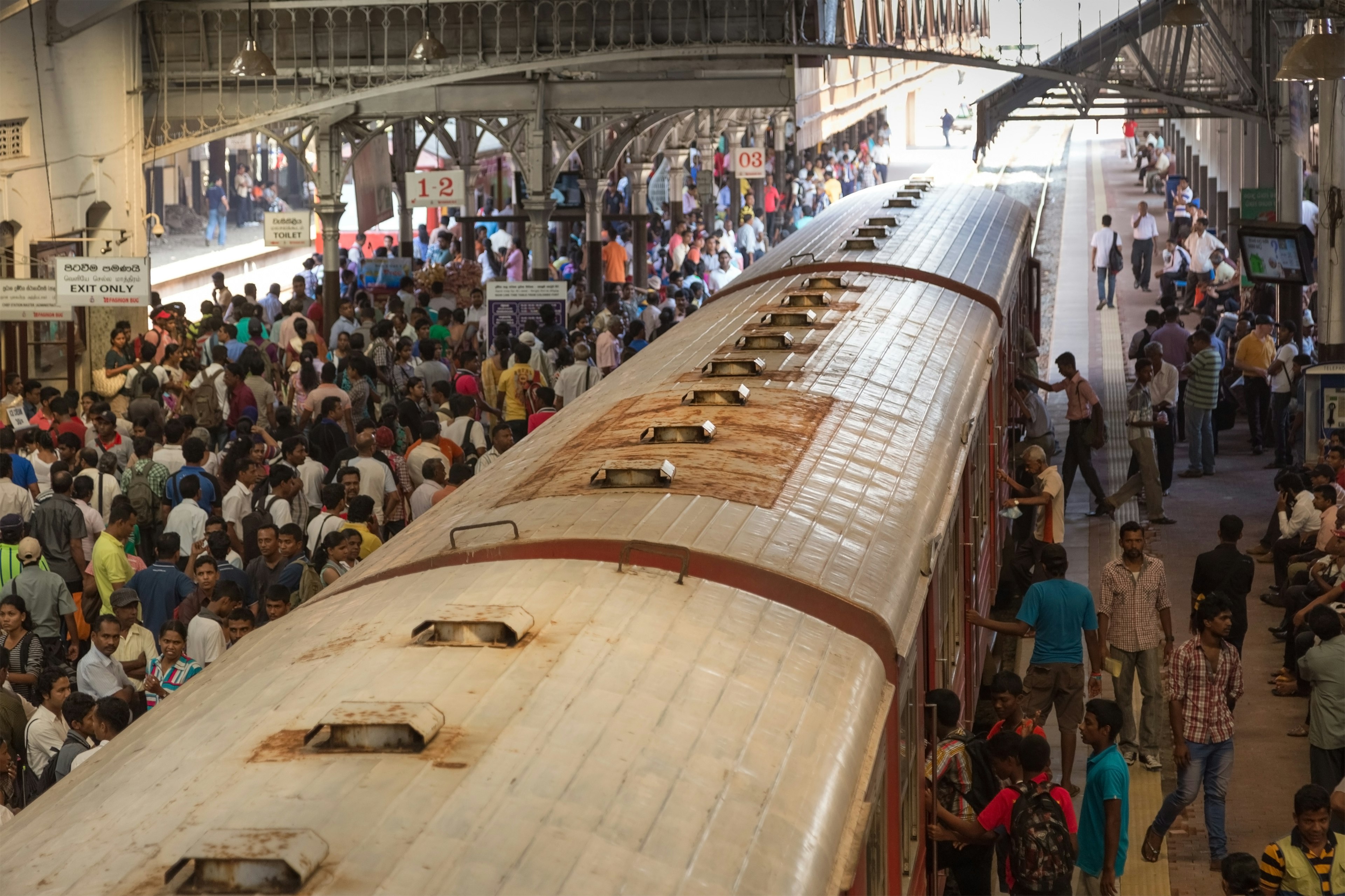 Local people waiting at main train station. The train is a great way to get around Sri Lanka, as it's cheap, safe and part of the experience.