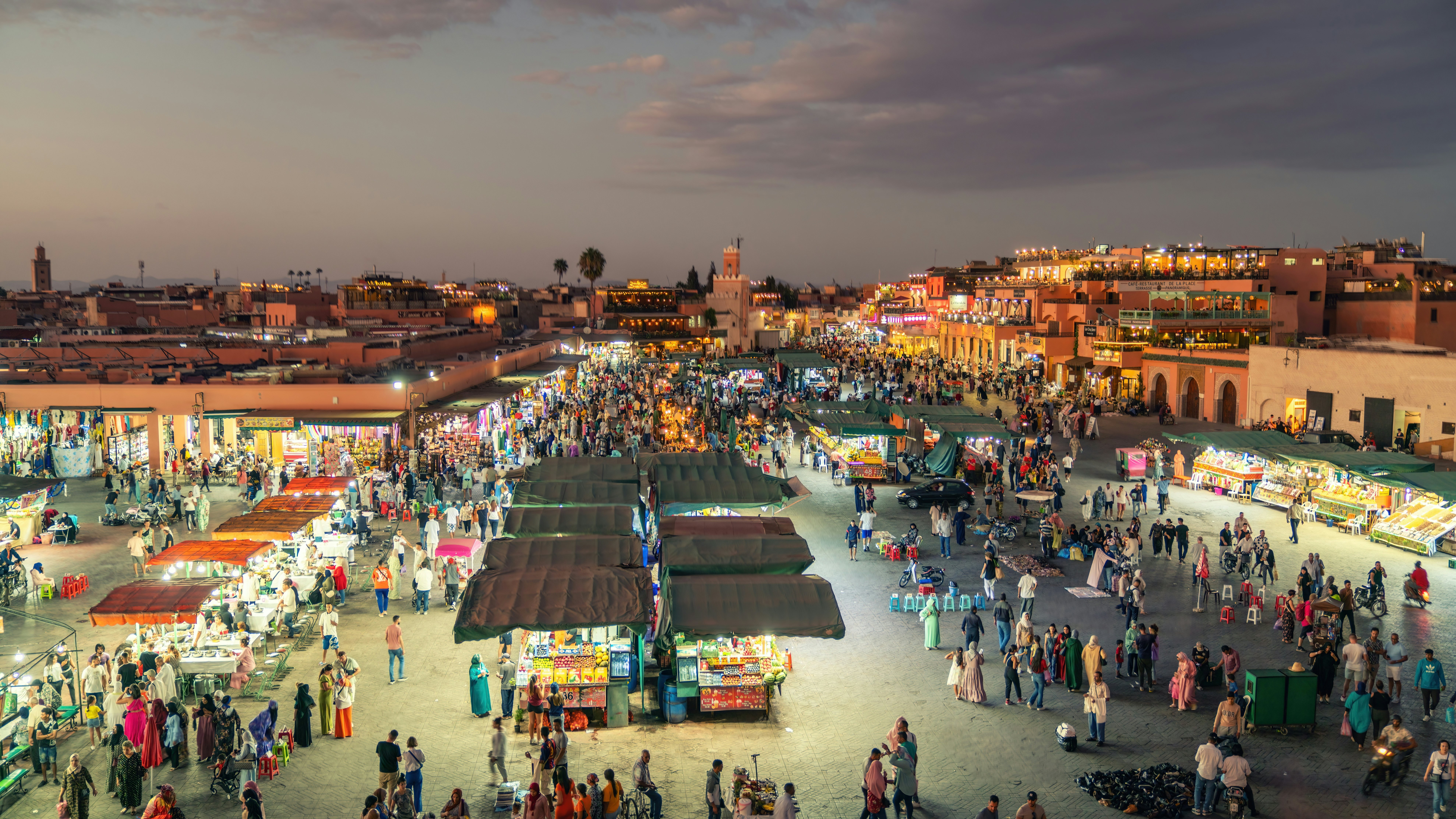 Jemaa el Fnaa square in the old city of Marrakesh in the evening, known for its vibrant atmosphere and diverse range of activities.