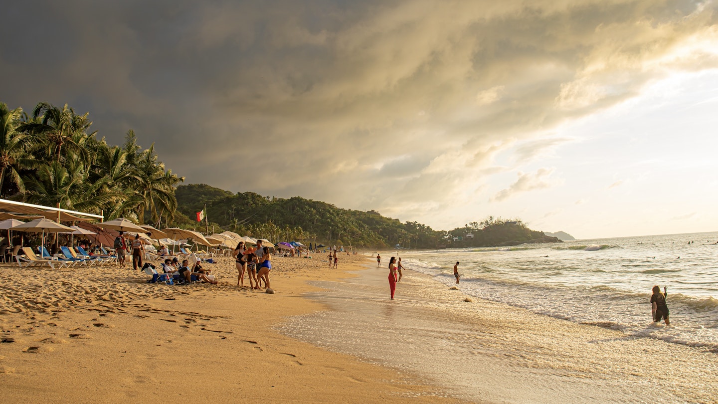 Sayulita Mexico October 15 2023 group of tourist loungeing on beach during sunset ; Shutterstock ID 2397606913; purchase_order: 65050 - Digital Destinations and Articles; job: Lonely Planet Online Editorial; client: First-time guide to Sayulita; other: Brian Healy
2397606913
active, adult, background, beach, beautiful, beauty, calm, clouds, cloudy, coastline, crashing, destination, footprints, island, jungle, mexico, nature, nayarit, ocean, pacific ocean, peaceful, people, resort, san pancho, silhouette, sun, sunrise, sunset, surf, tourism, tourist, travel, tropical, umbrellas, vacation, waves
Sayulita Mexico October 15 2023 group of tourist loungeing on beach during sunset