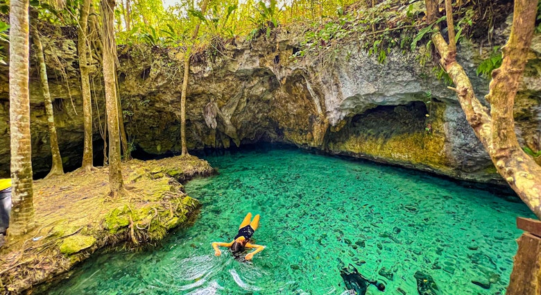 Woman swimming in Tulum Cenotes That Are Worth a Visit, Cenotes around tulum and playa del carmen that deserve a visit at least once. Mexico world tourist place, License Type: media_digital, Download Time: 2024-11-07T13:25:52.000Z, User: clairenaylor, Editorial: false, purchase_order: 65050 - Digital Destinations and Articles, job: Online editorial, client: Cenotes Tulum, other: Claire Naylor