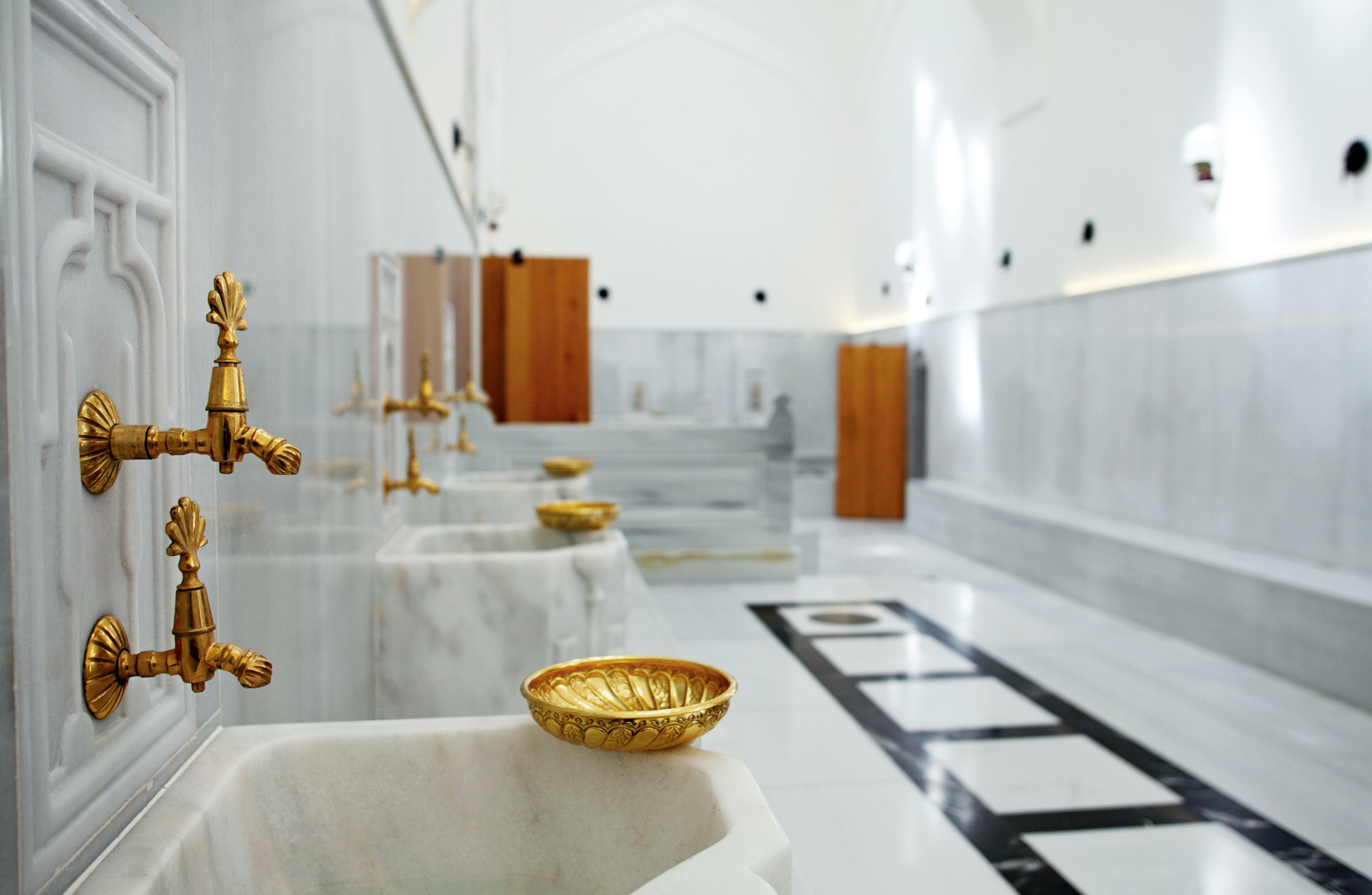 Interior of a turkish hamam with marble sinks