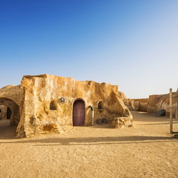 Abandoned sets for the shooting of the movie Star Wars in the Sahara desert on a background of sand dunes in Tunisia