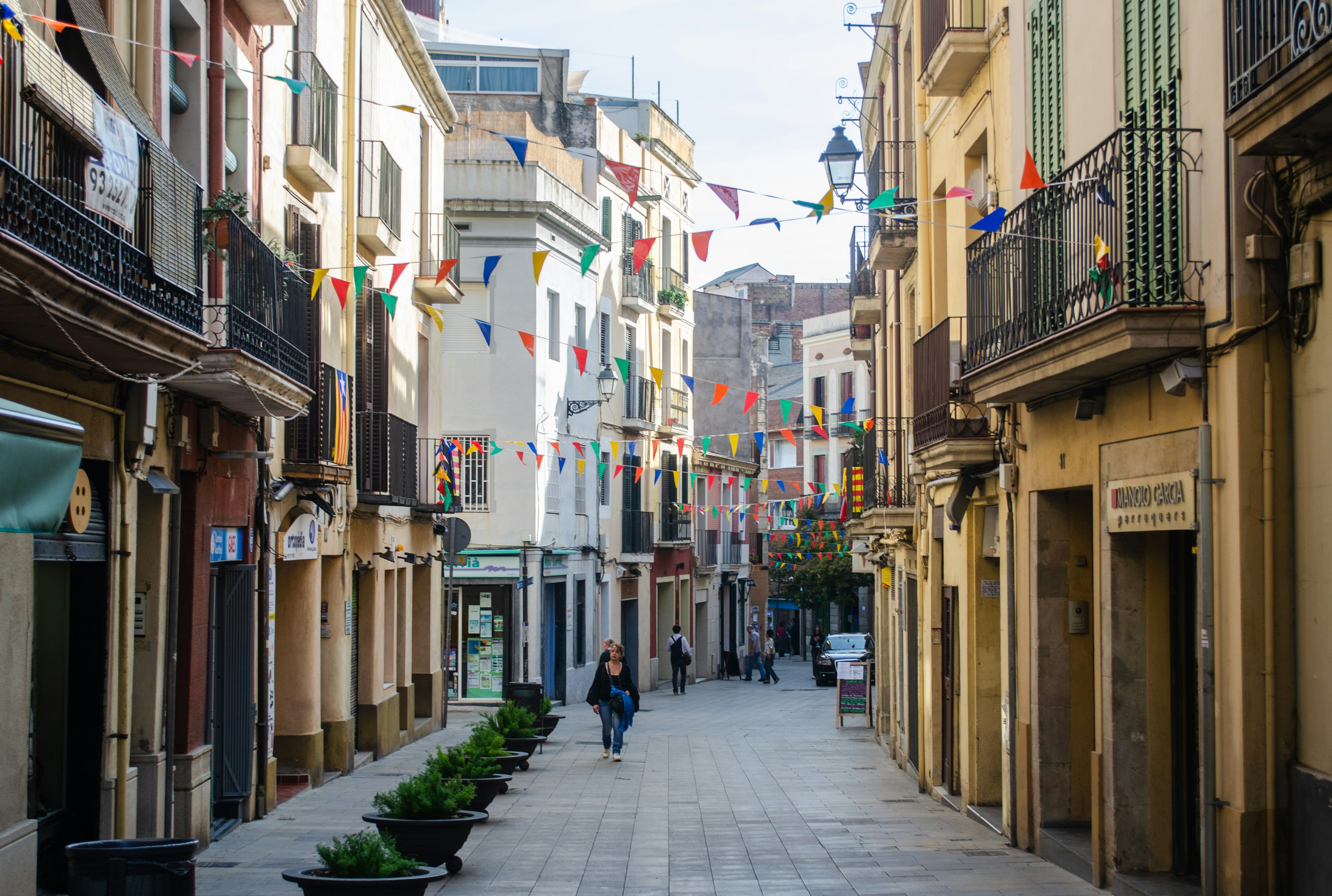 A view of Carrer Major de Sarria, which is the main street in the Sarria neighborhood in the Sarria-Sant Gervasi district of Barcelona.