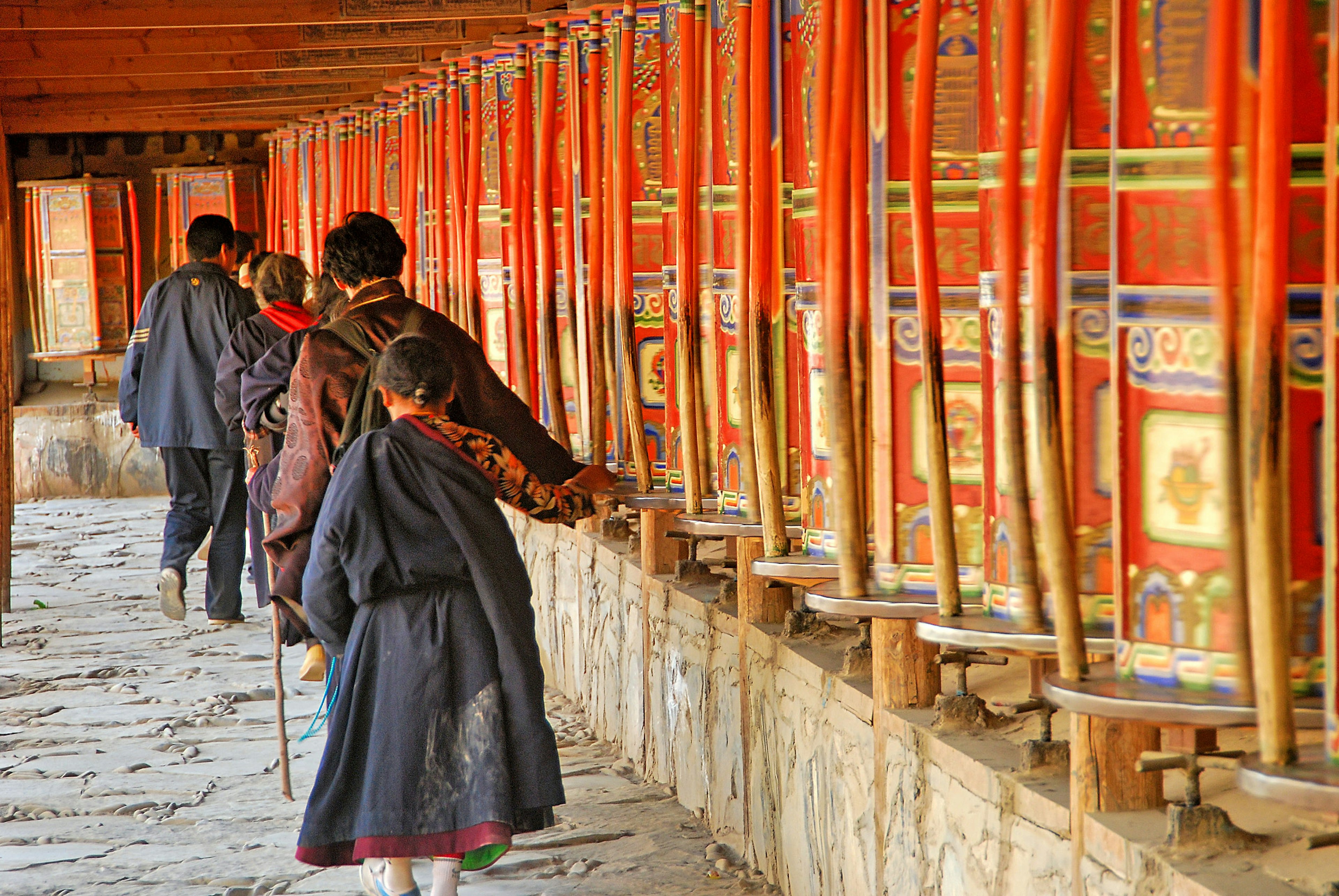 People spin prayer wheels at Labrang Monastery.