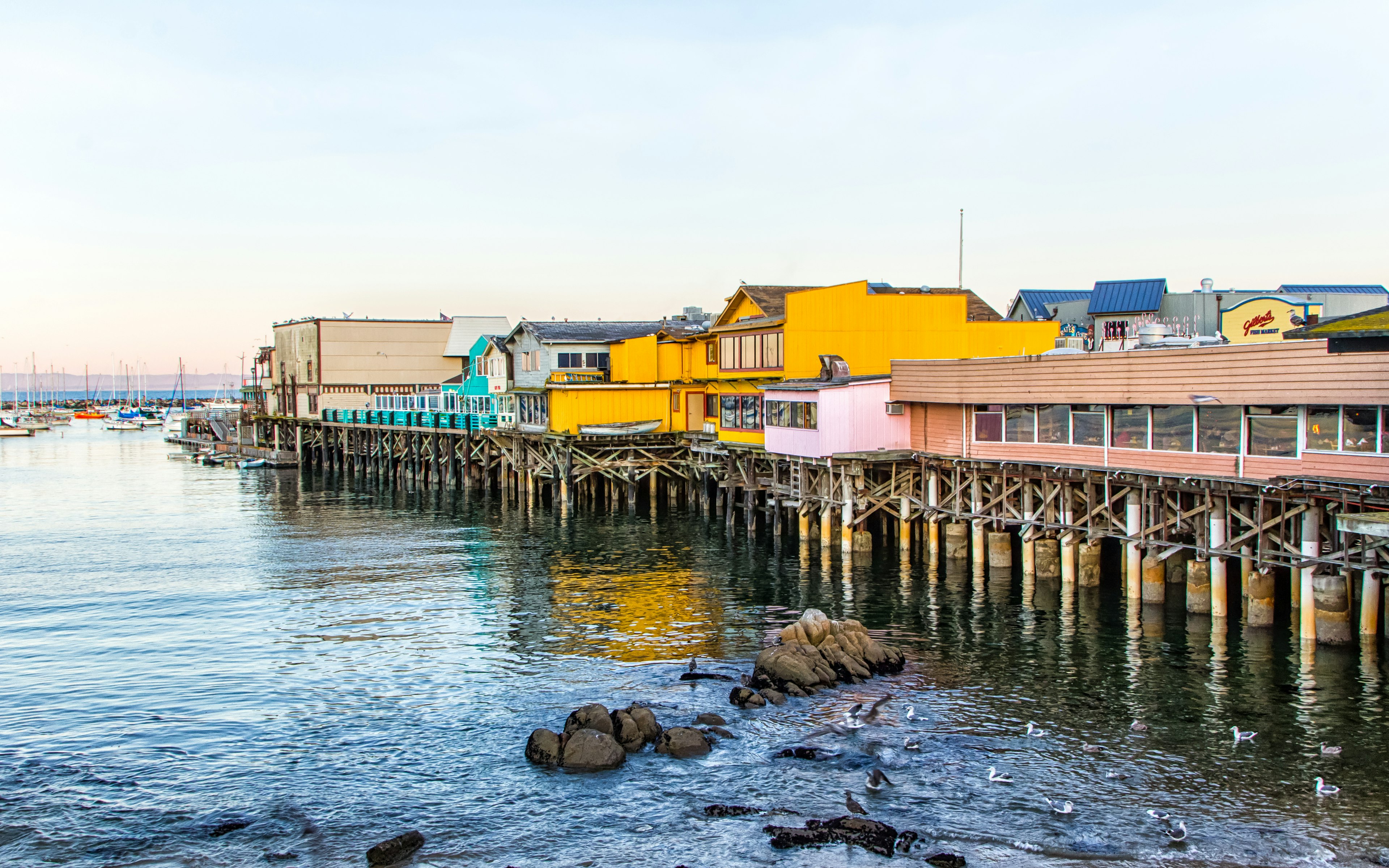 Monterey Wharf and Marina where fishing, sport and tourism combine to play vital economic roles in the vitality of Monterey Bay, California.