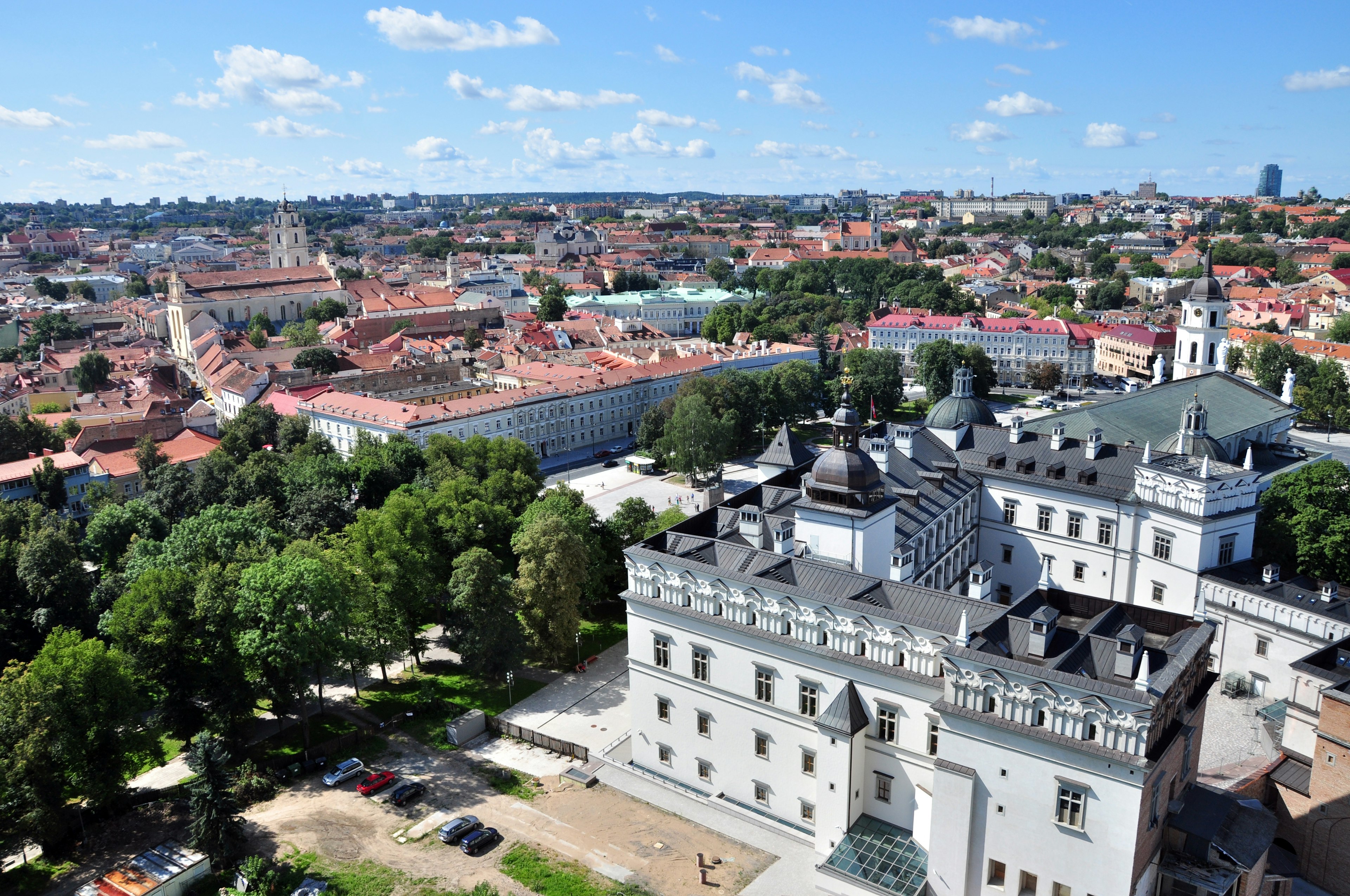 A large baroque palace building on the edge of a city square