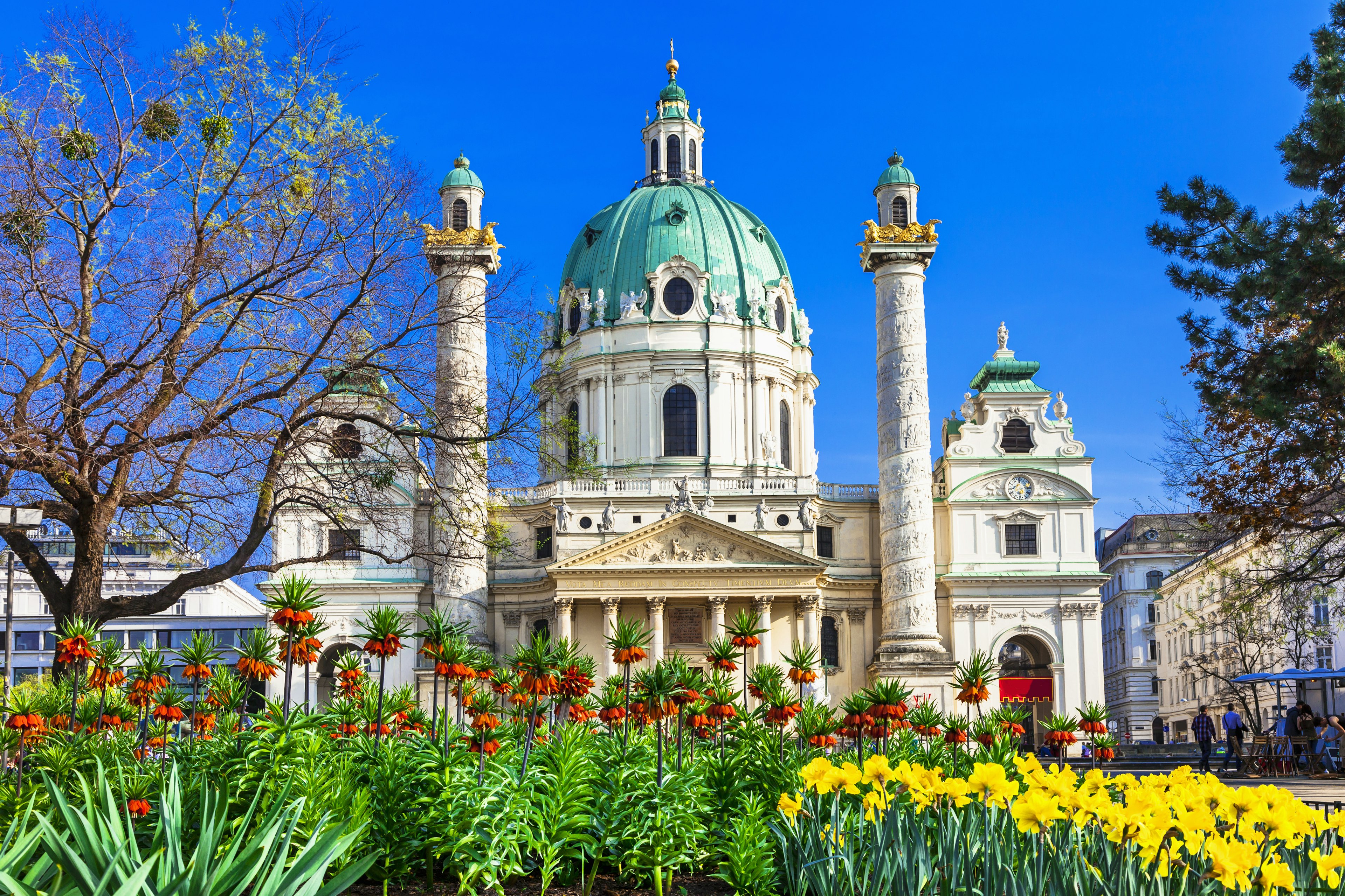 A garden of flowers with Karlskirche in the background.