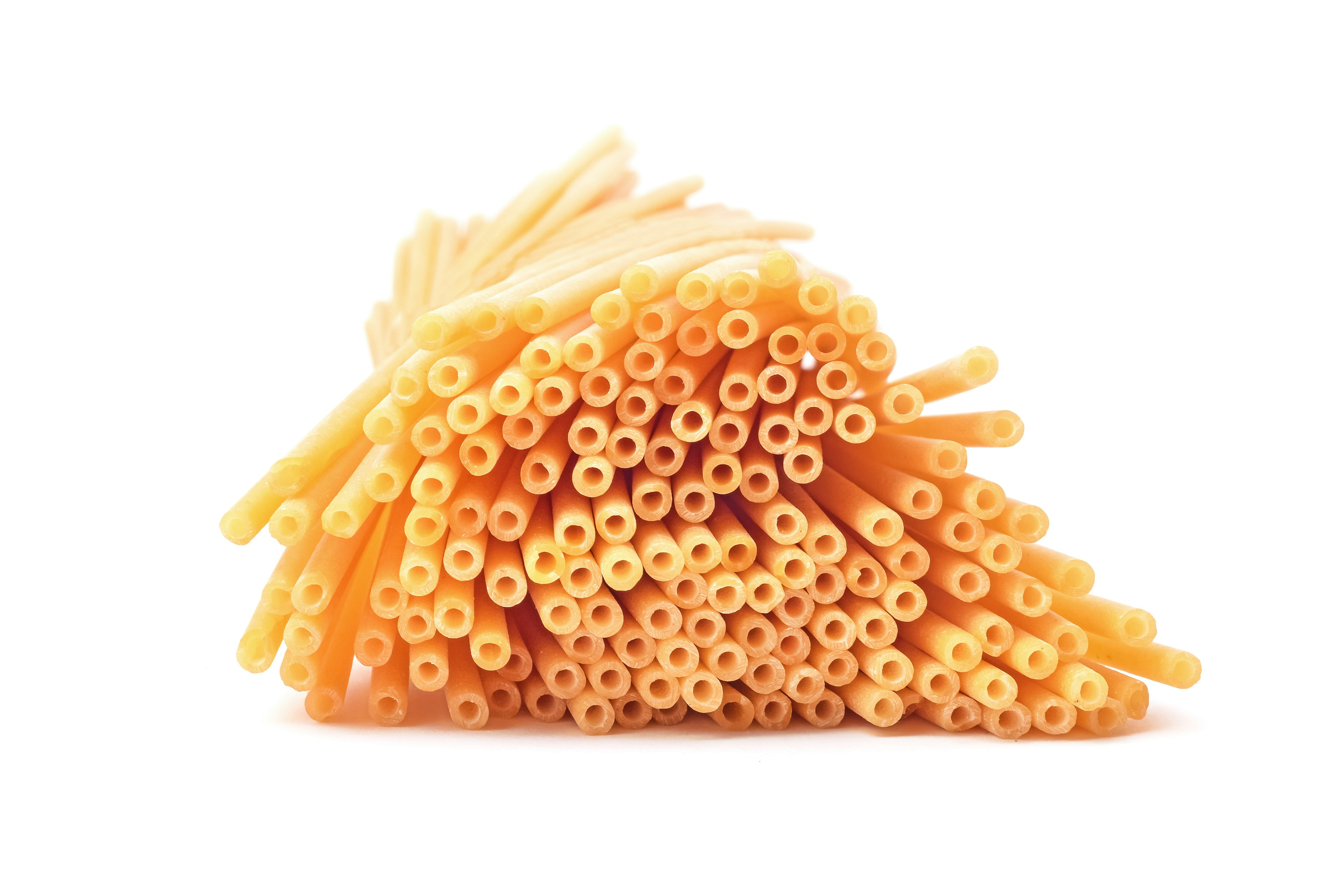 Bucatini pasta, isolated on white.