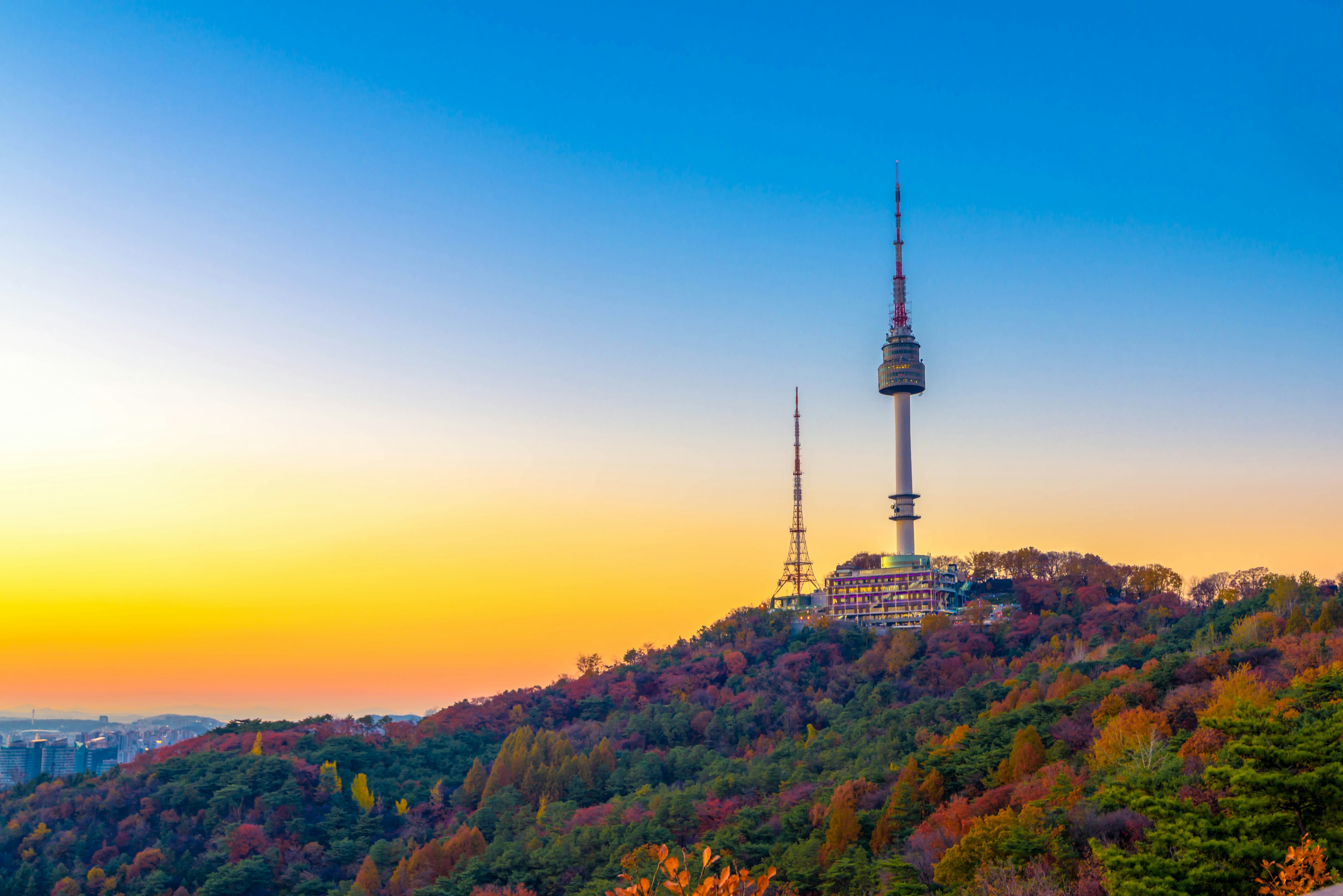 Sunset behind Namsan Mountain and the Namsan Seoul Tower during autumn.