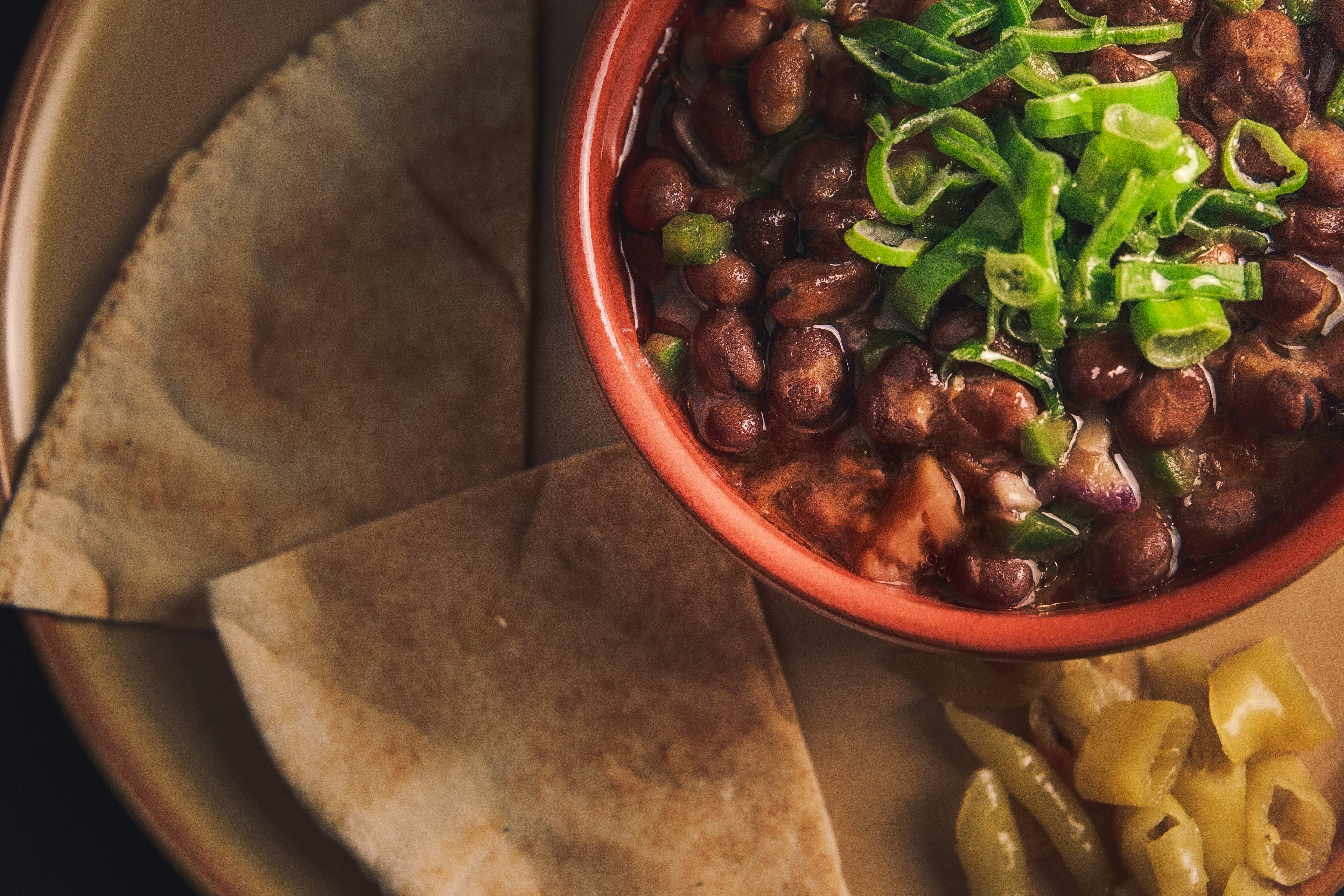 Fuul, fava beans with vegetables and pita bread, often eaten for breakfast in Egypt