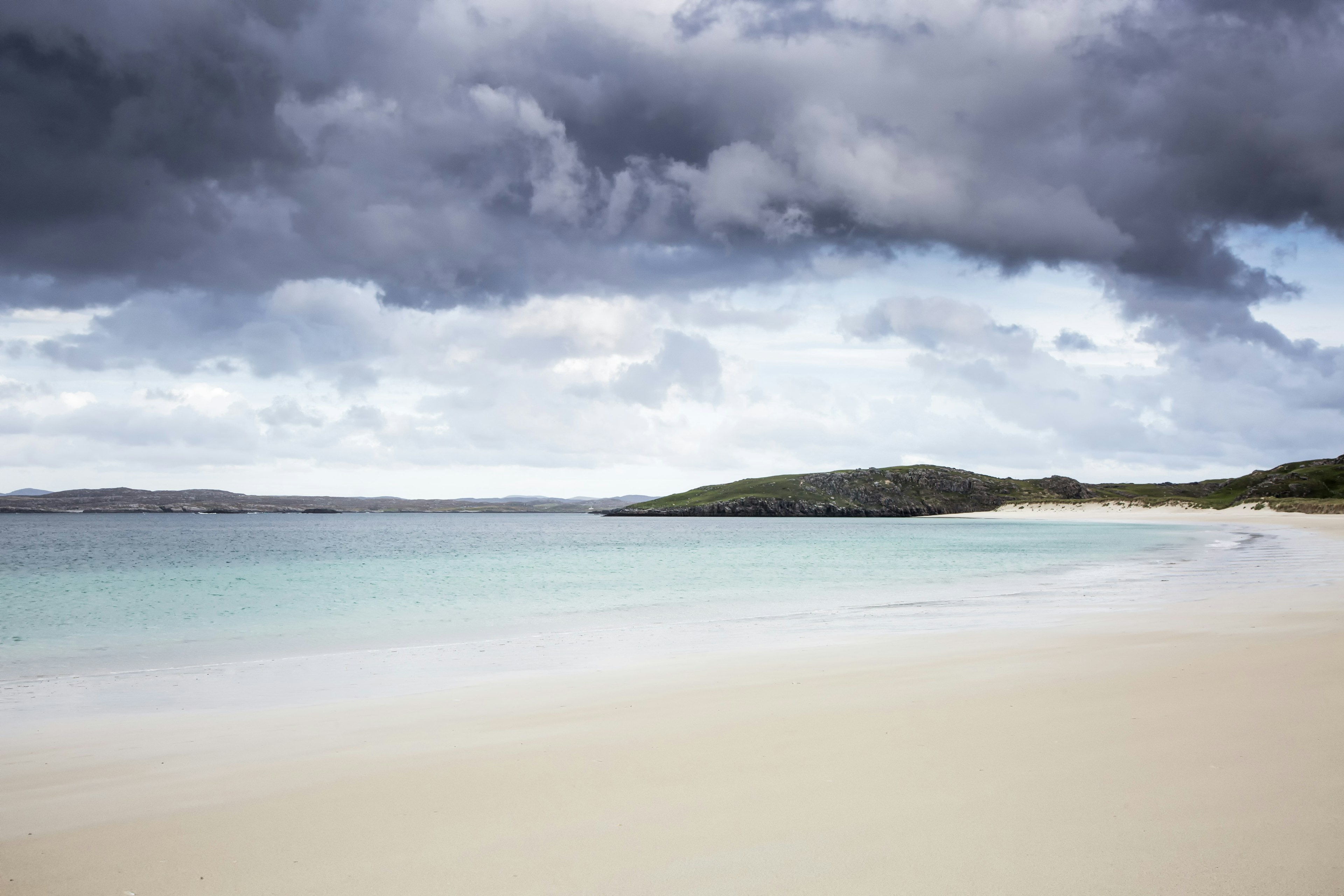 Storm clouds over tranquil ocean beach, Cnip, in the Outer Hebrides.