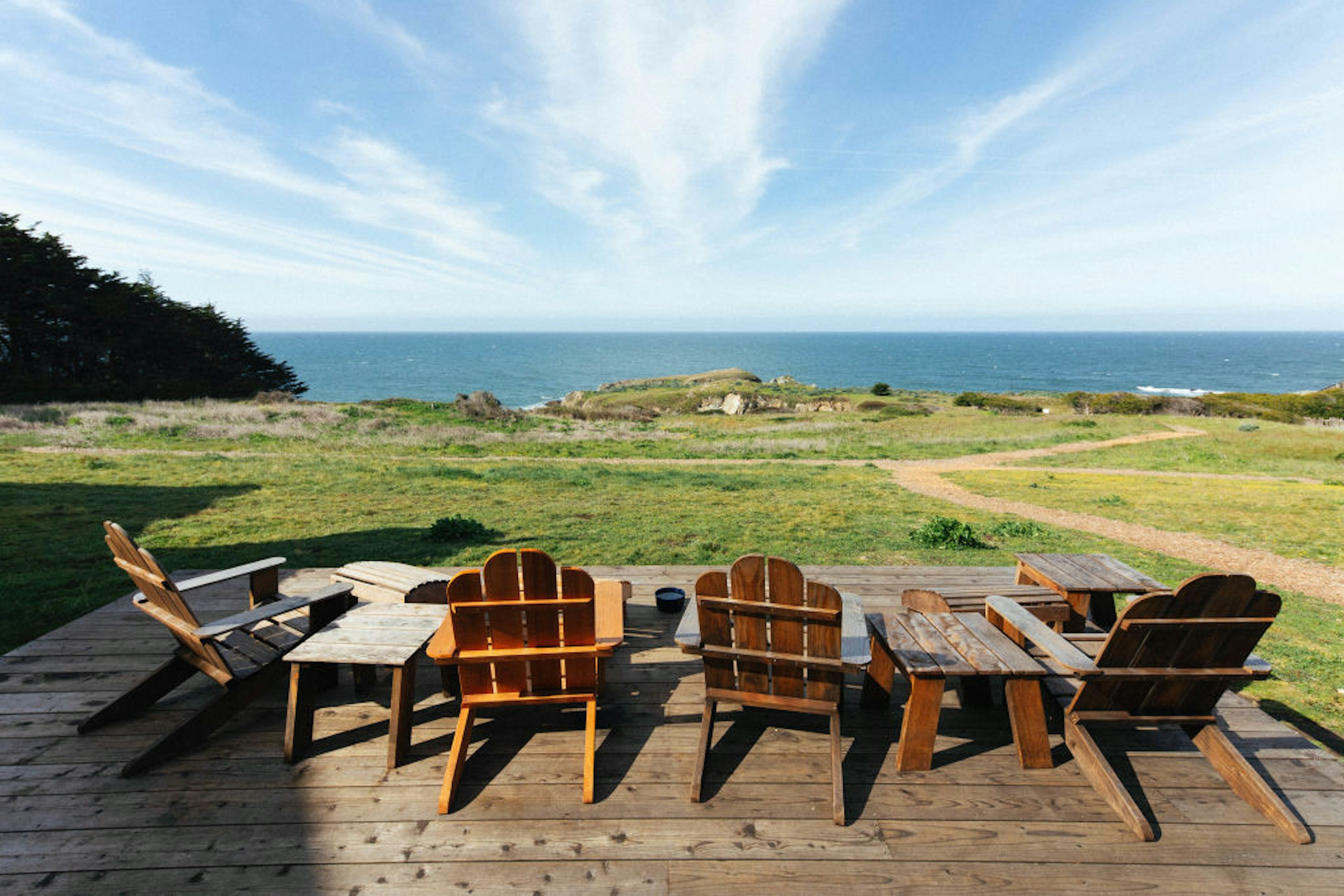 Adirondack chairs and a view of the ocean at Sea Ranch Lodge.