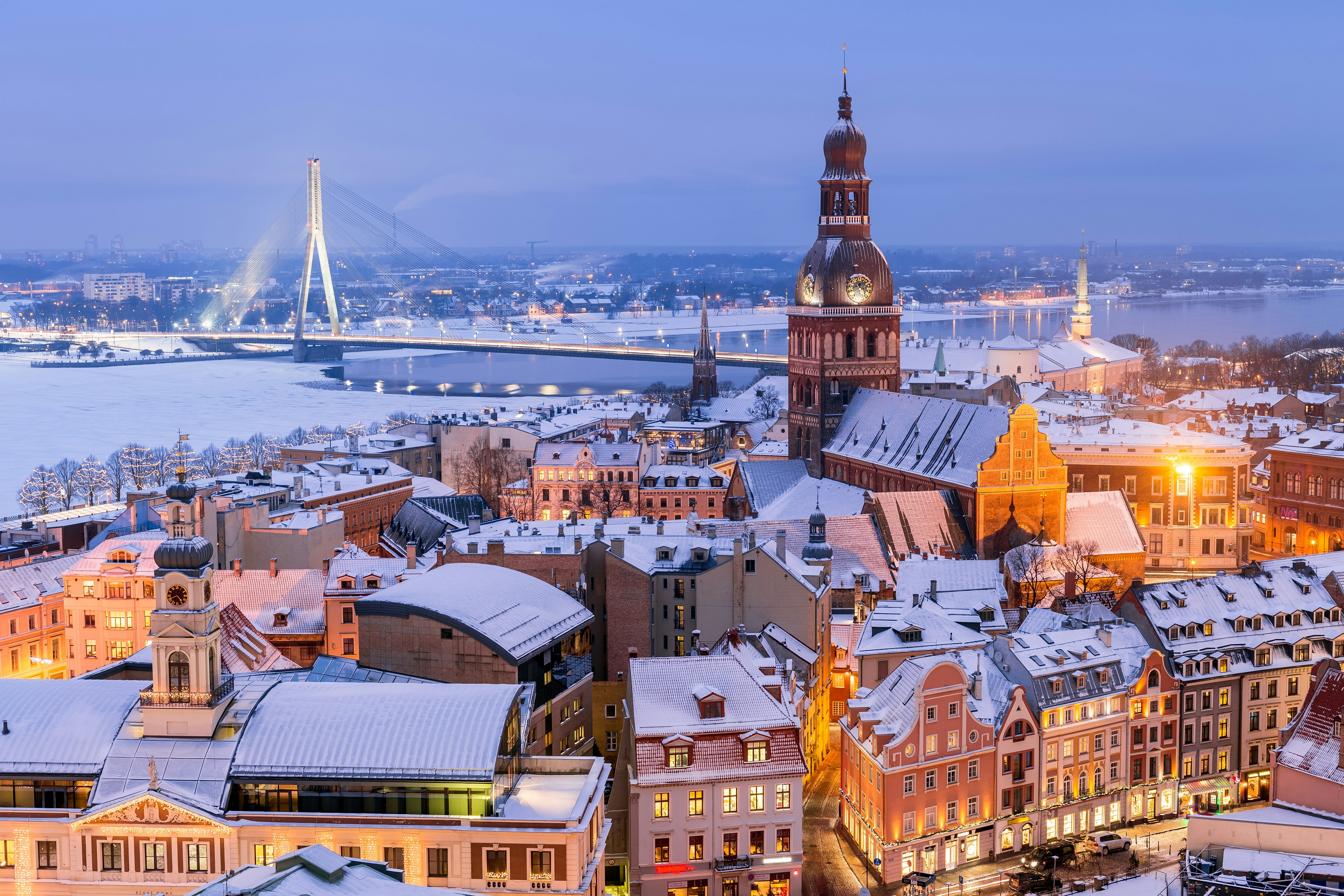 Riga Cathedral (centre right) and Latvia Vanšu Bridge in winter.