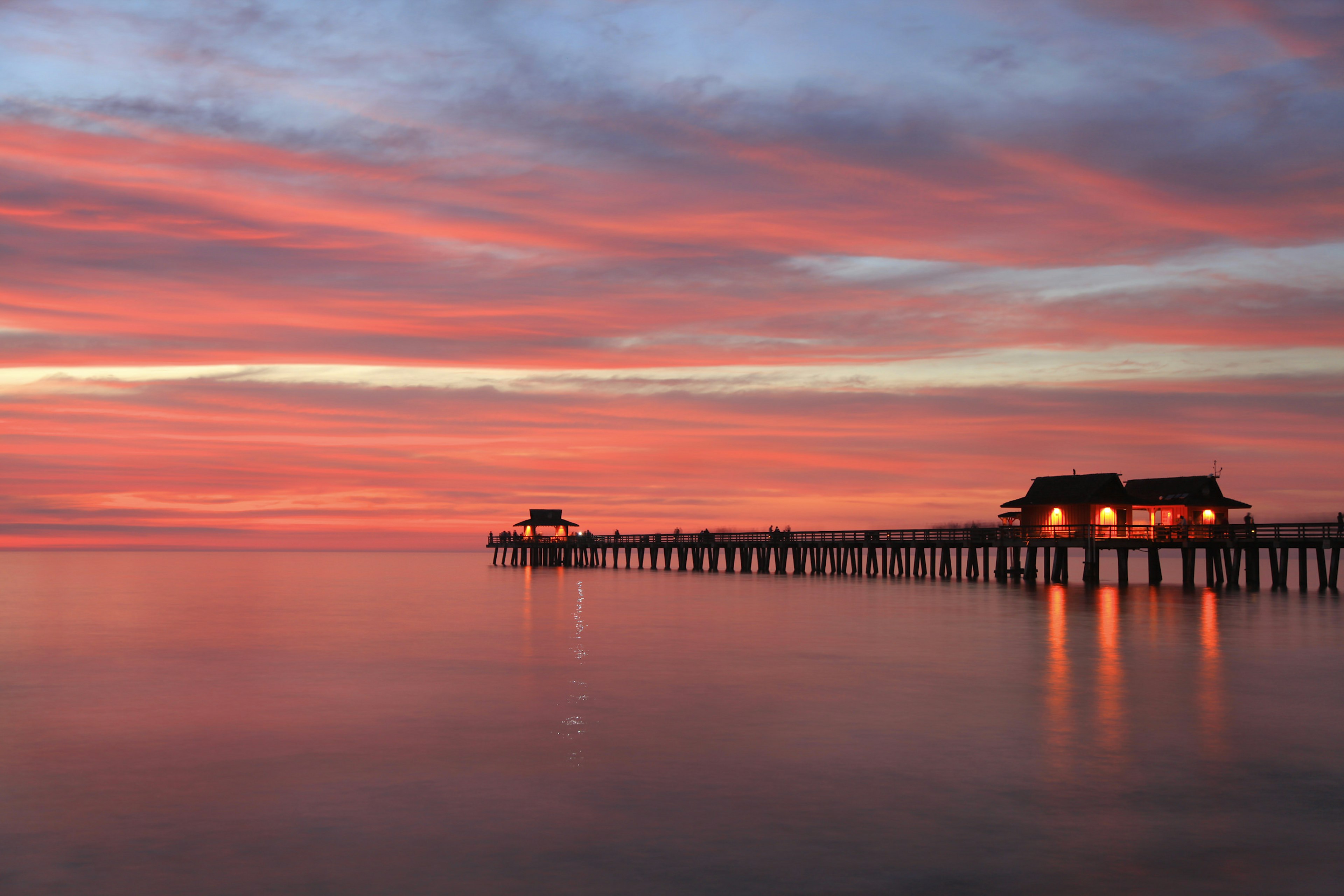 Naples Pier at sunset in the Gulf of Mexico.