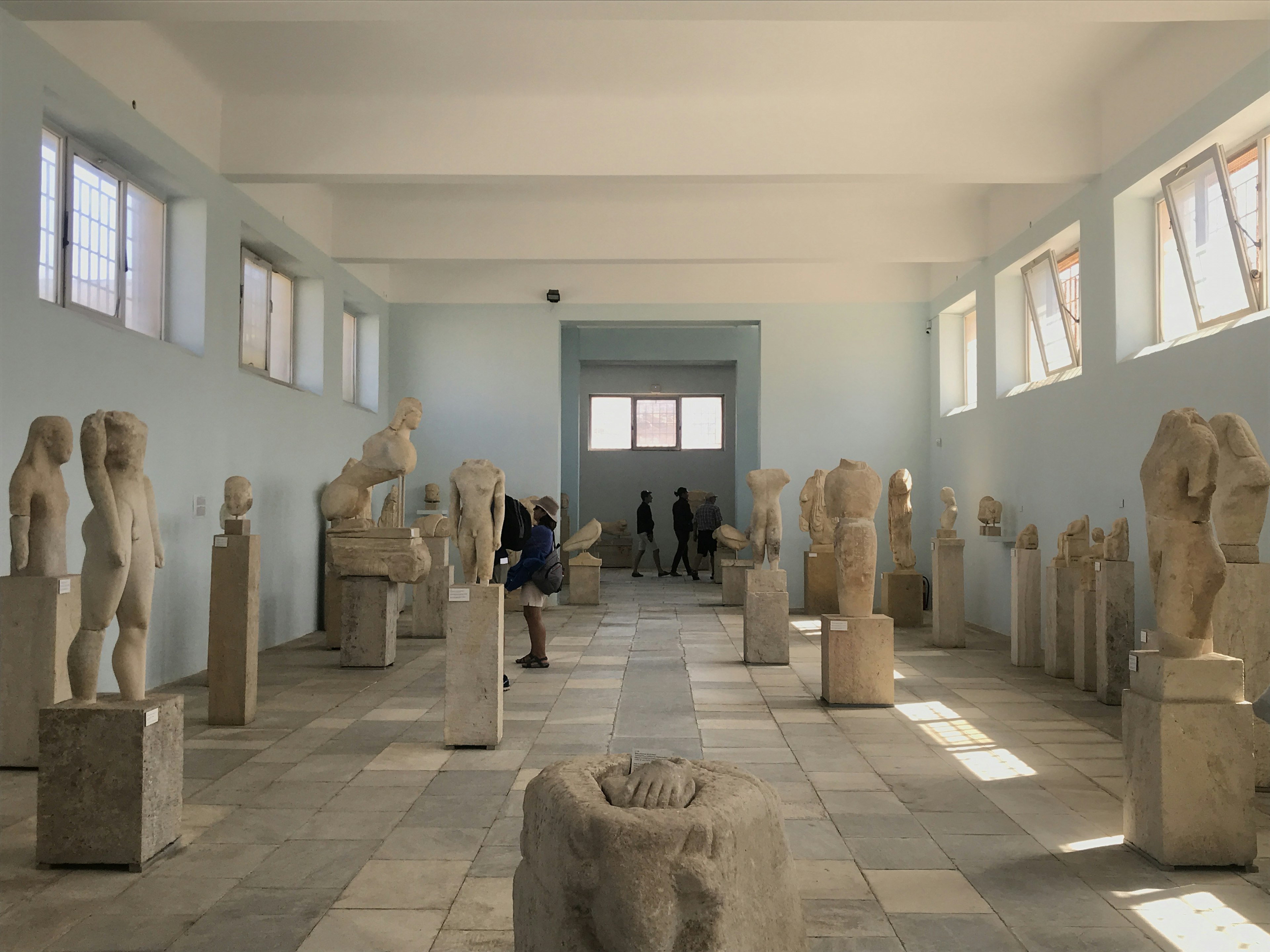 Marble statues fill a gallery