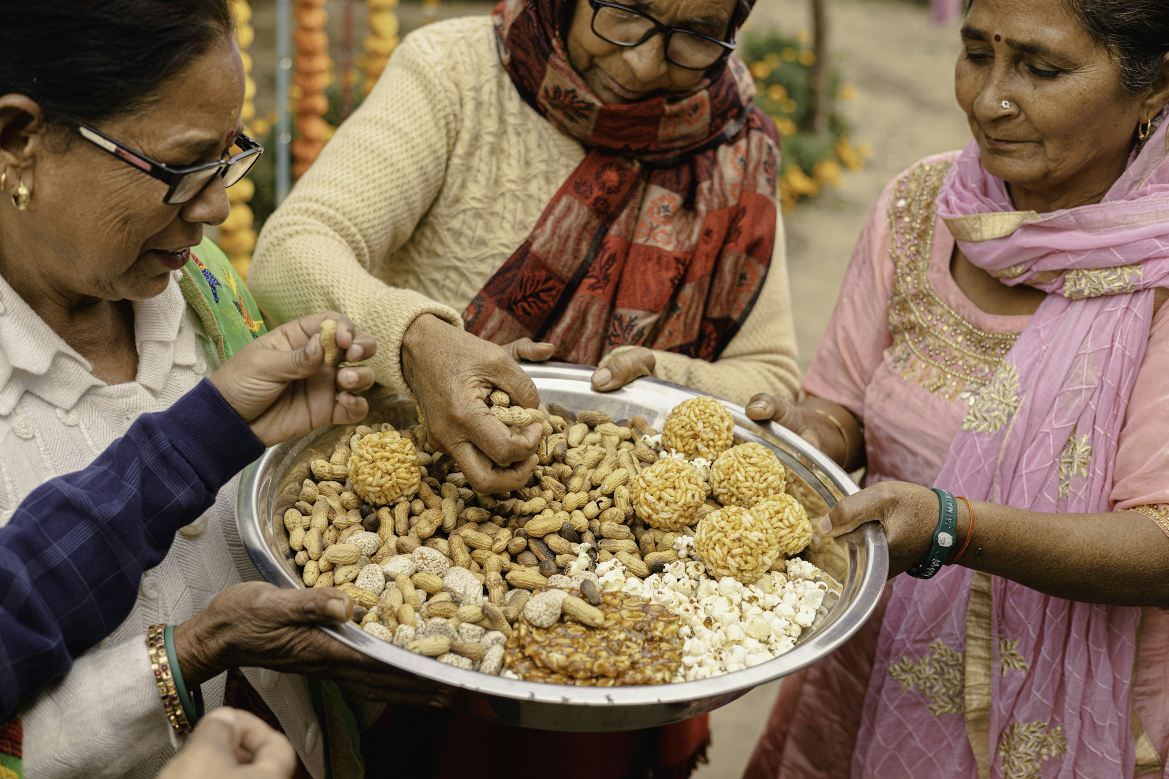 Indian women celebrate the festival of Lohri in the Punjab with festival foods.