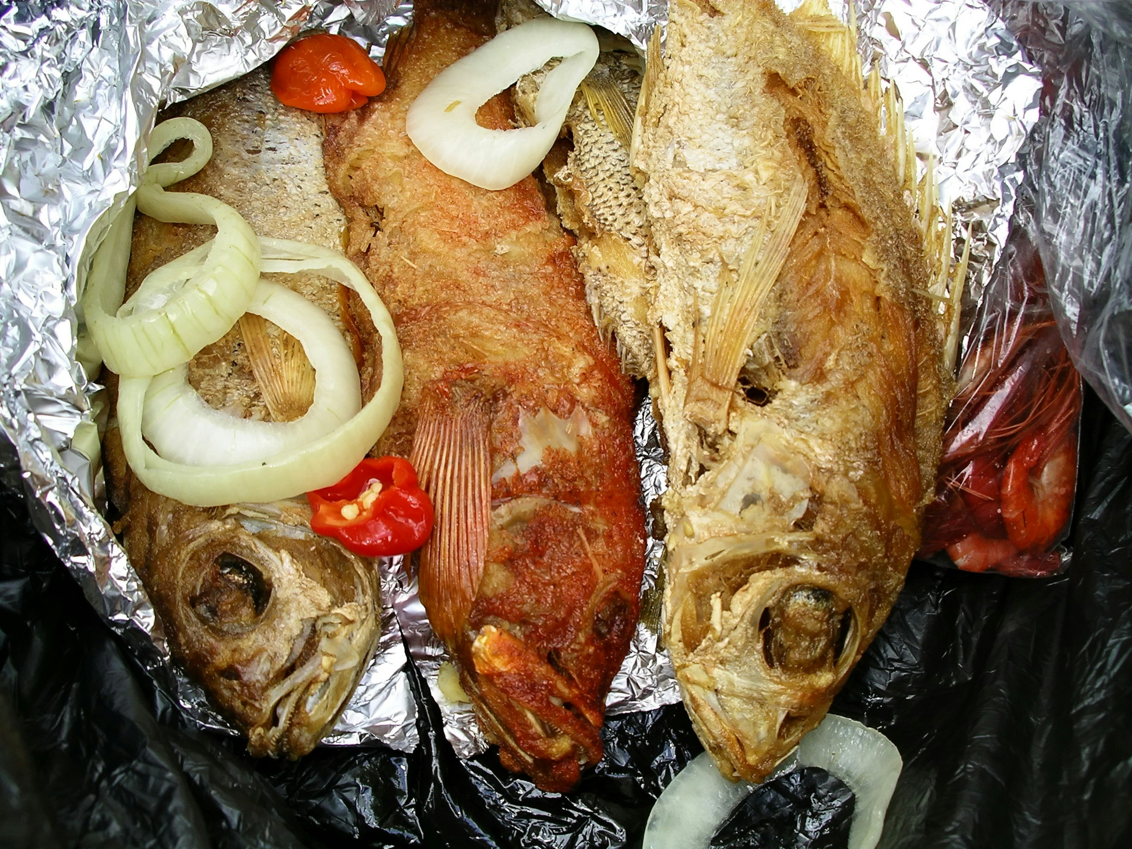 Fried fish for sale in Jamaica.