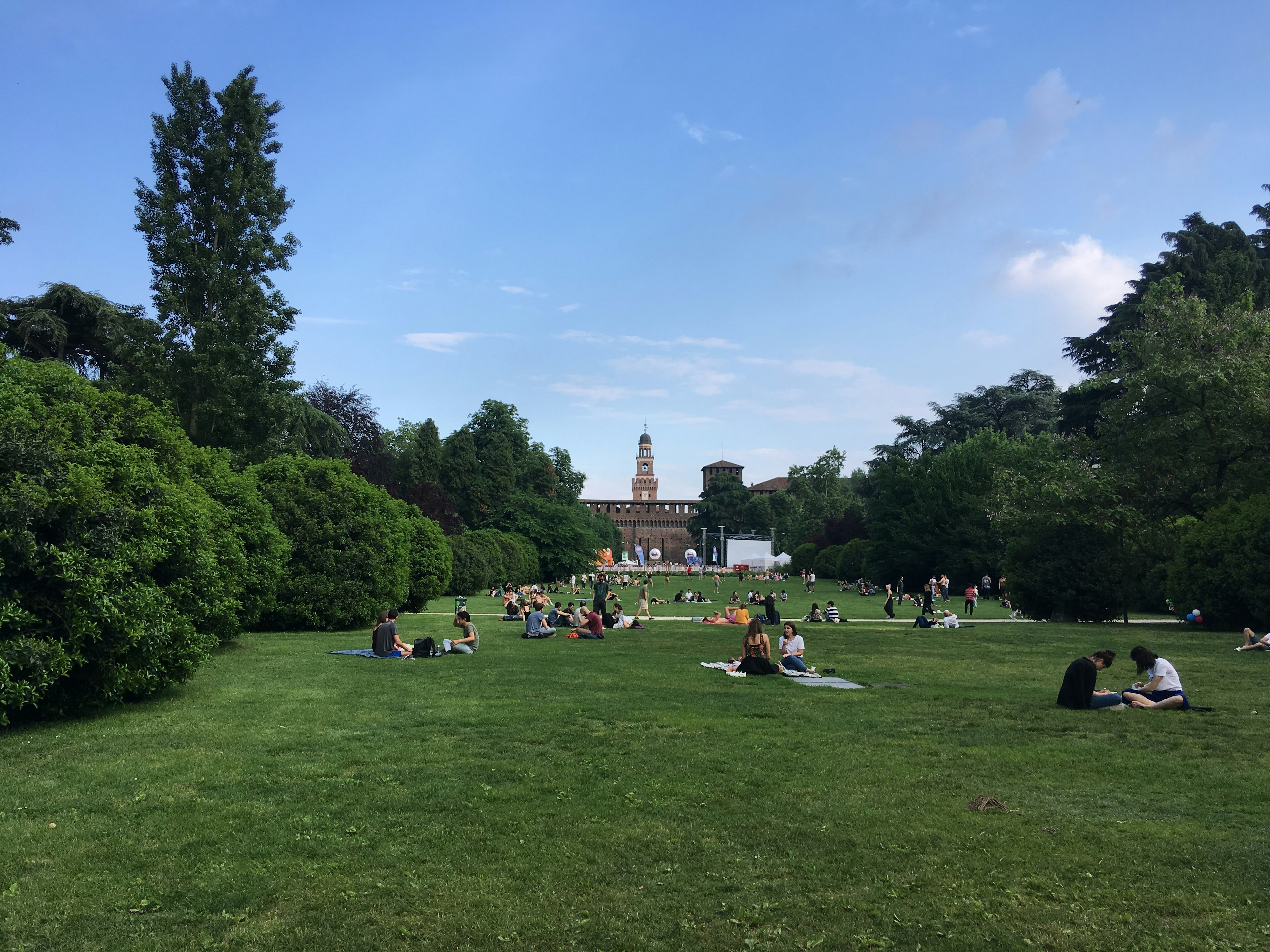 Locals hanging out on the grass in Parco Sempione