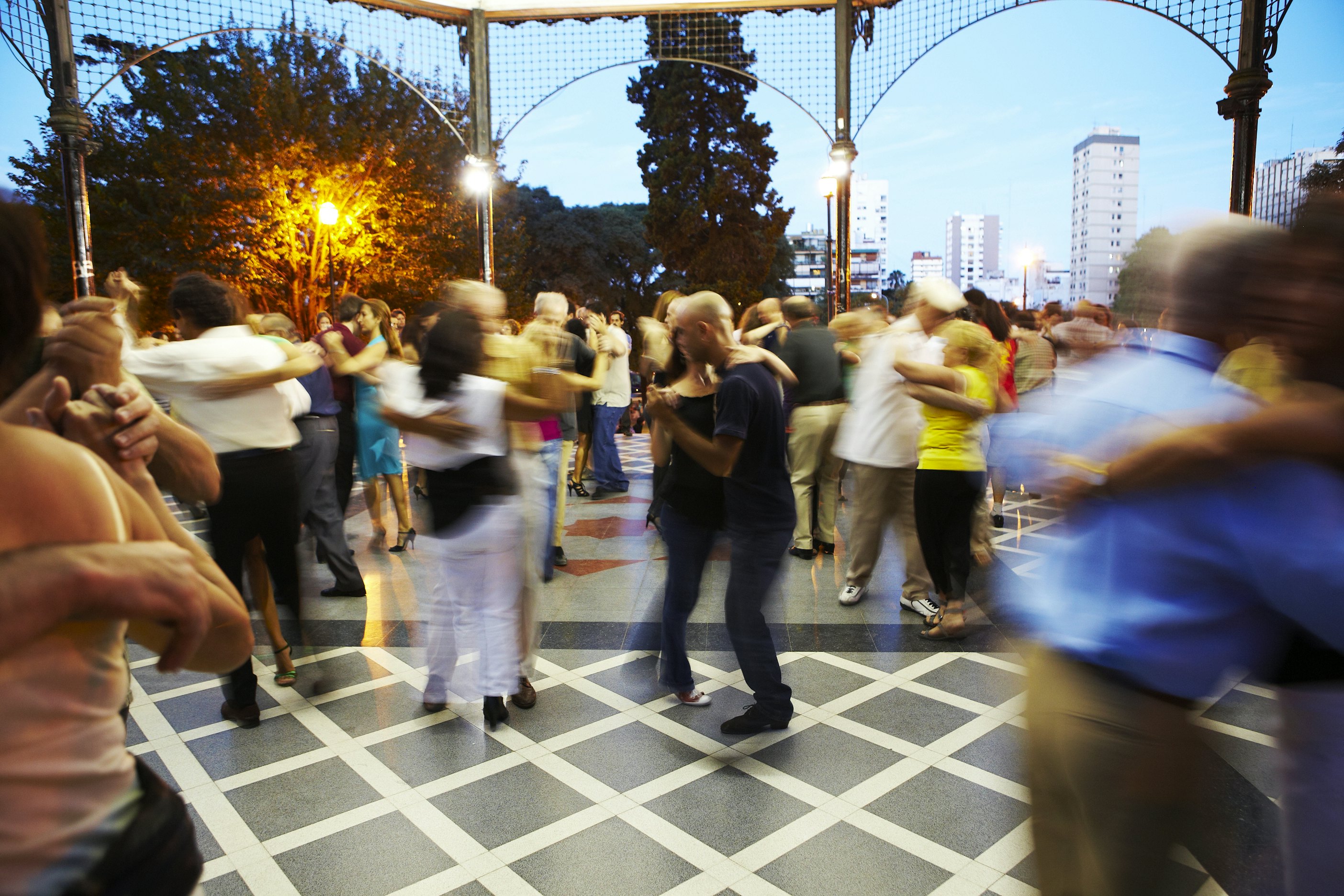 Couples dancing on an outdoor terrace