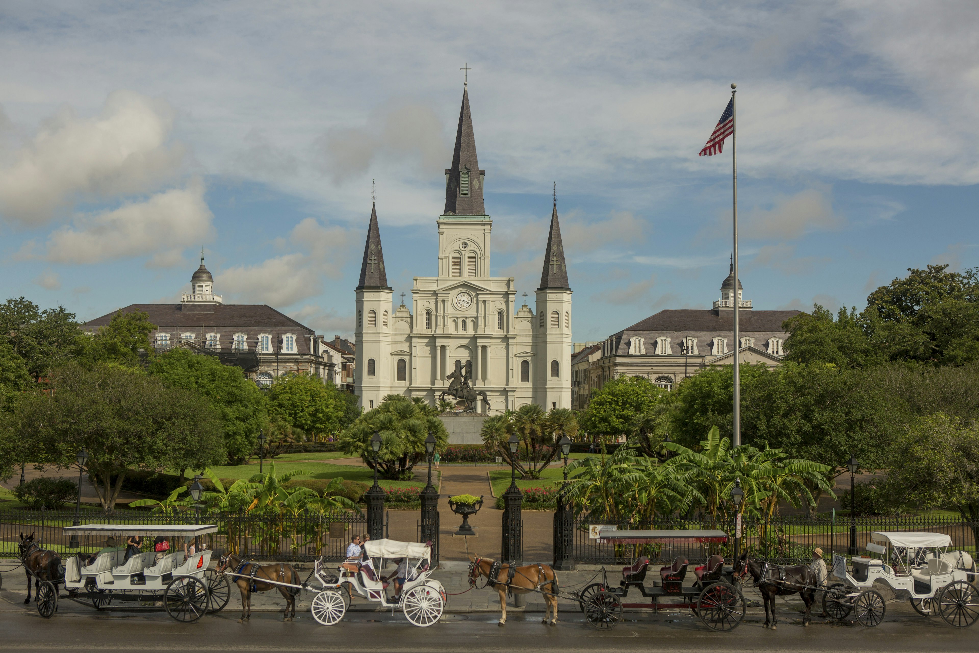 Horse drawn carriages in front of the St. Louis Cathedral in New Orleans, Louisiana.