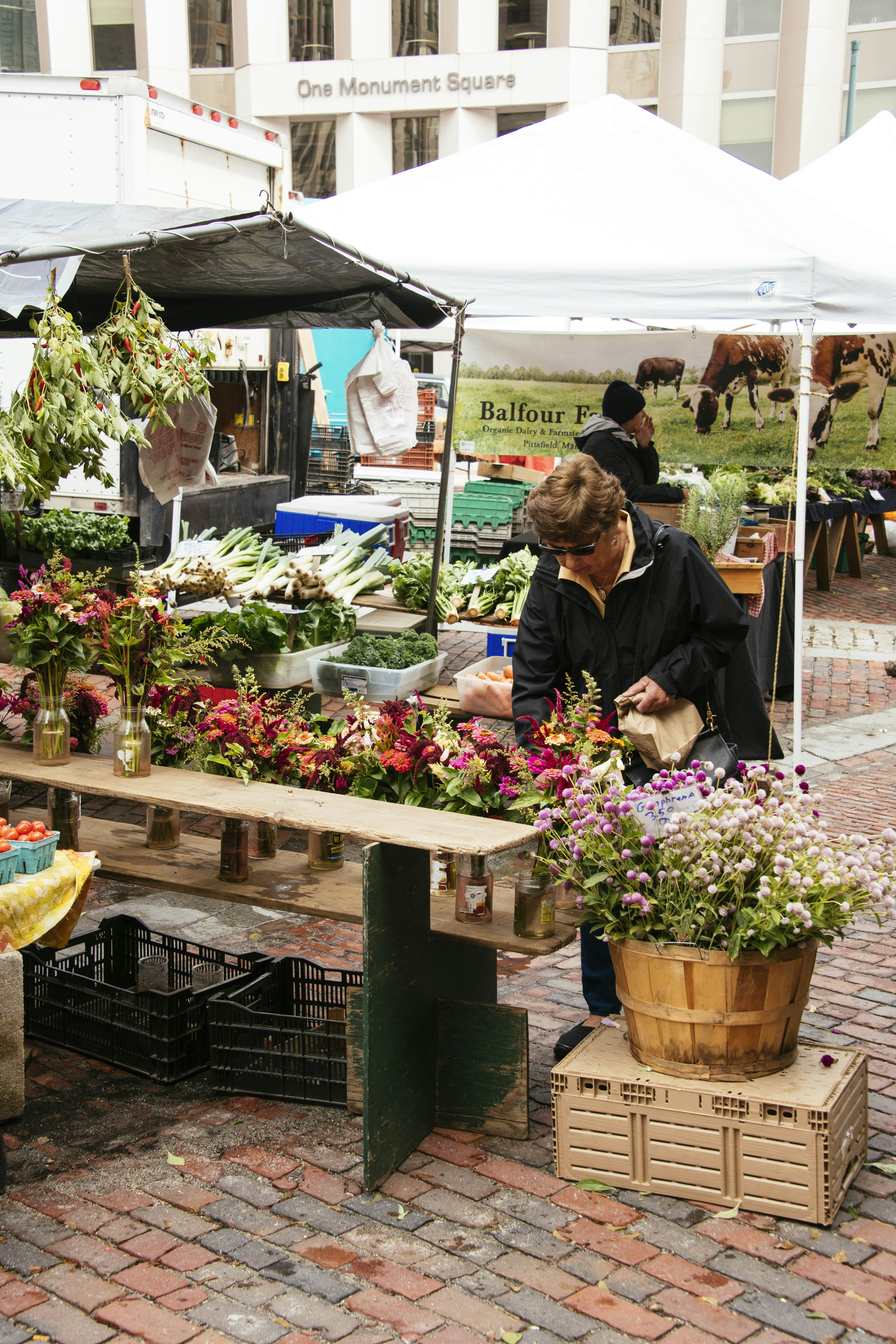 Flower stall at a farmers market .