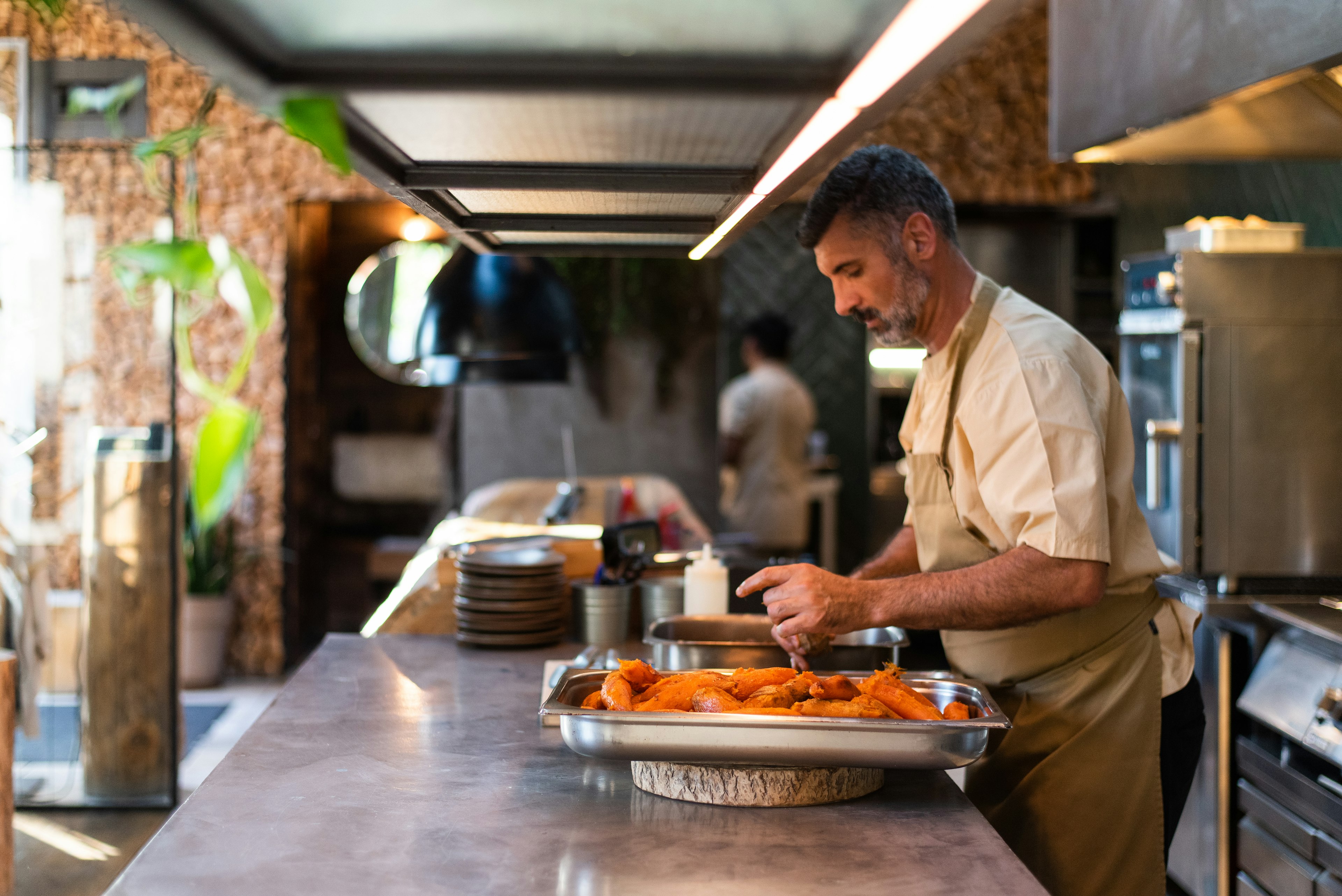 A chef prepping food in Fava Tonka Restaurant