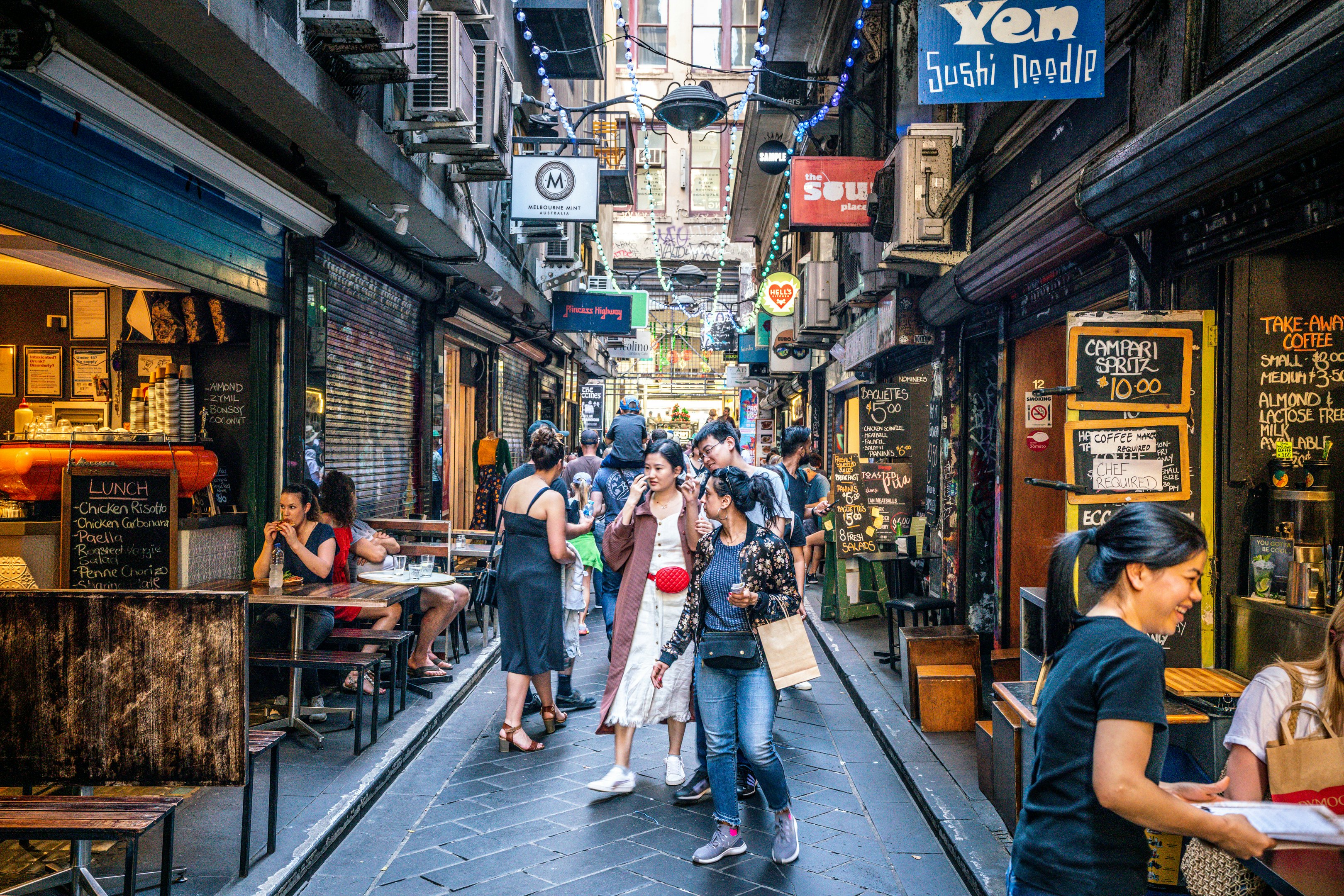 A street view of Centre Place, an iconic pedestrian laneway with cafe and people in Melbourne, Australia .