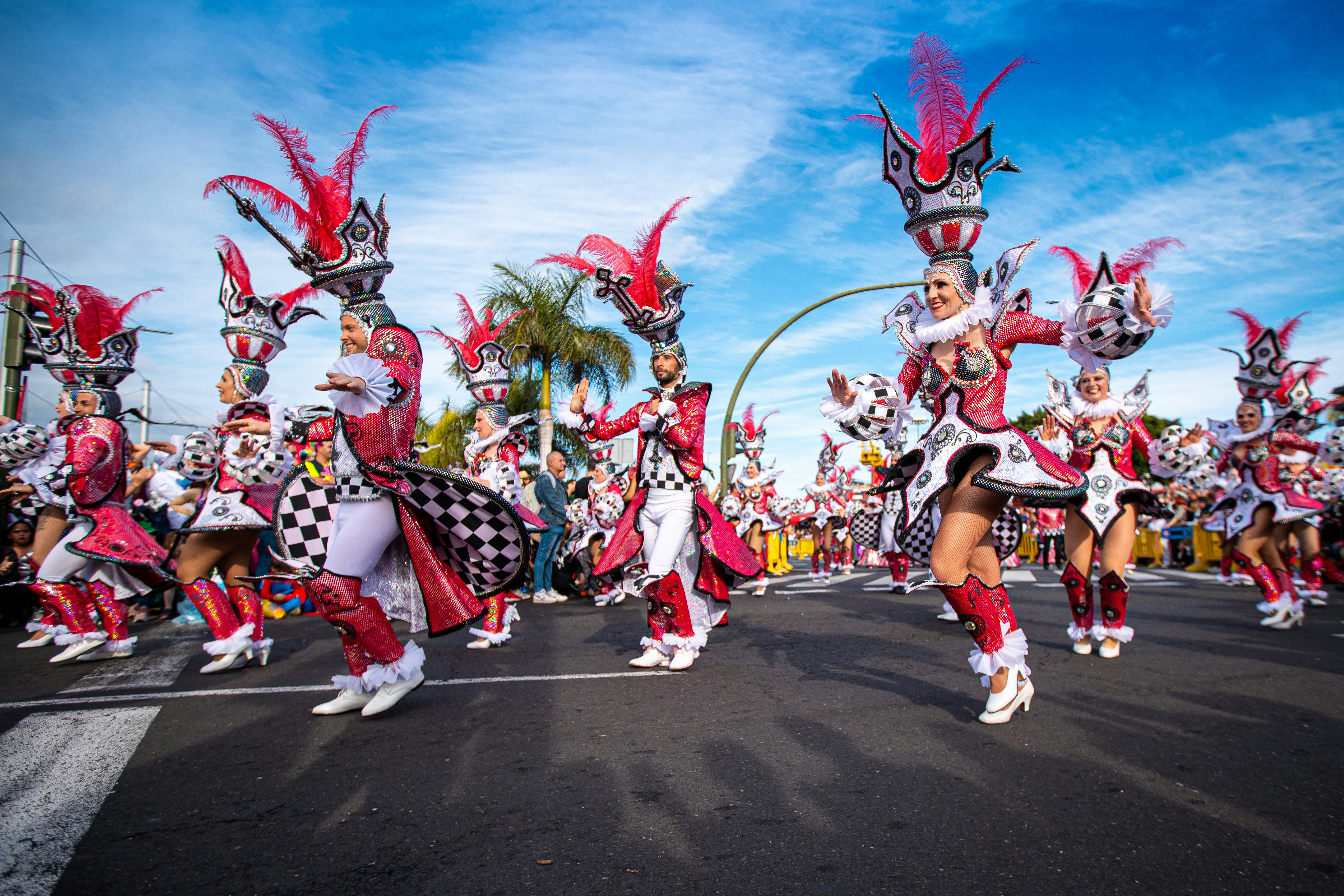 People dressed in sparkly costumes dance in the parade at Carnival in Santa Cruz de Tenerife.