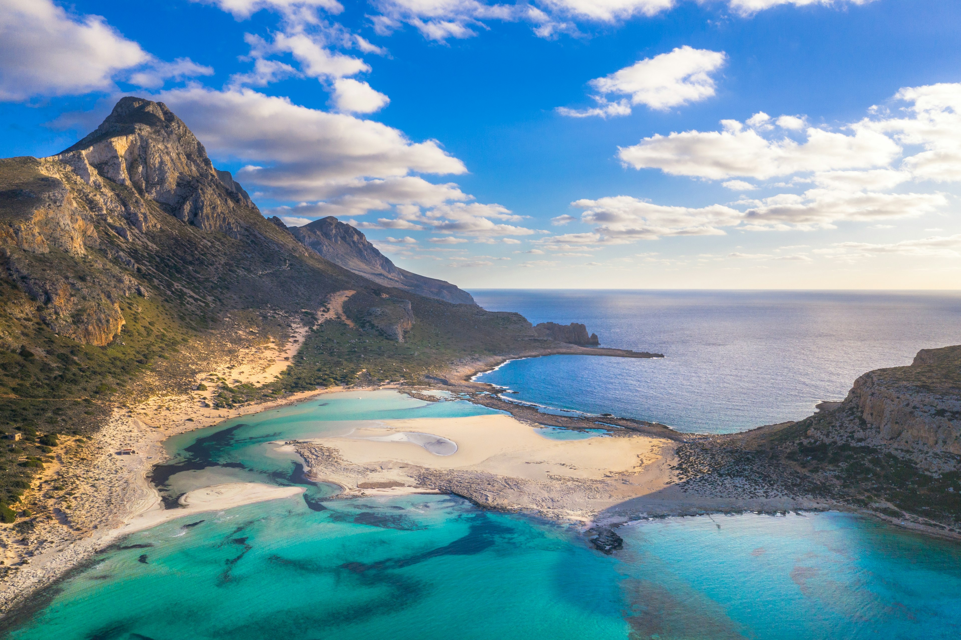 A beautiful lagoon and beach near a mountain peak