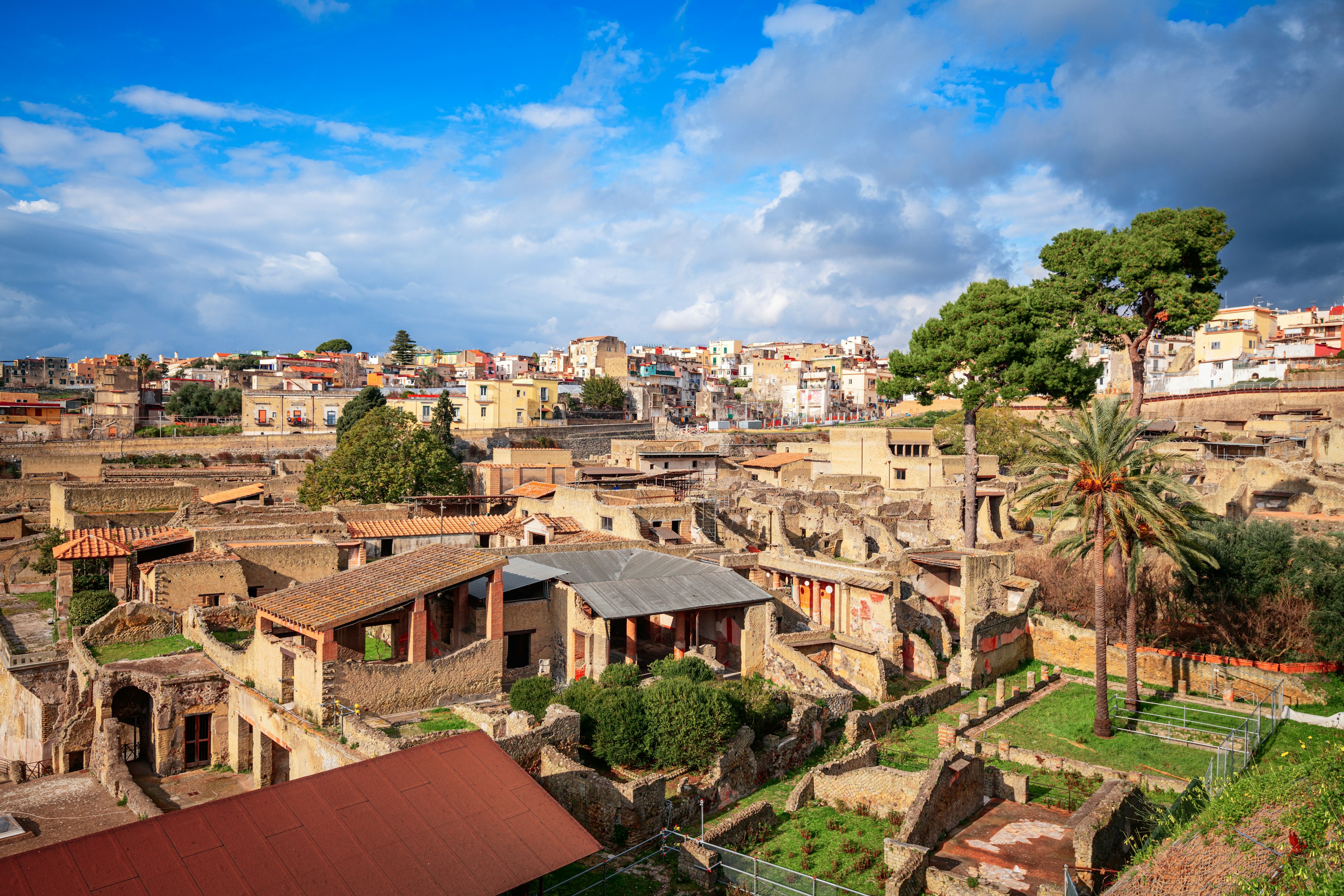 Ancient ruins of a town on the edge of a modern-day city