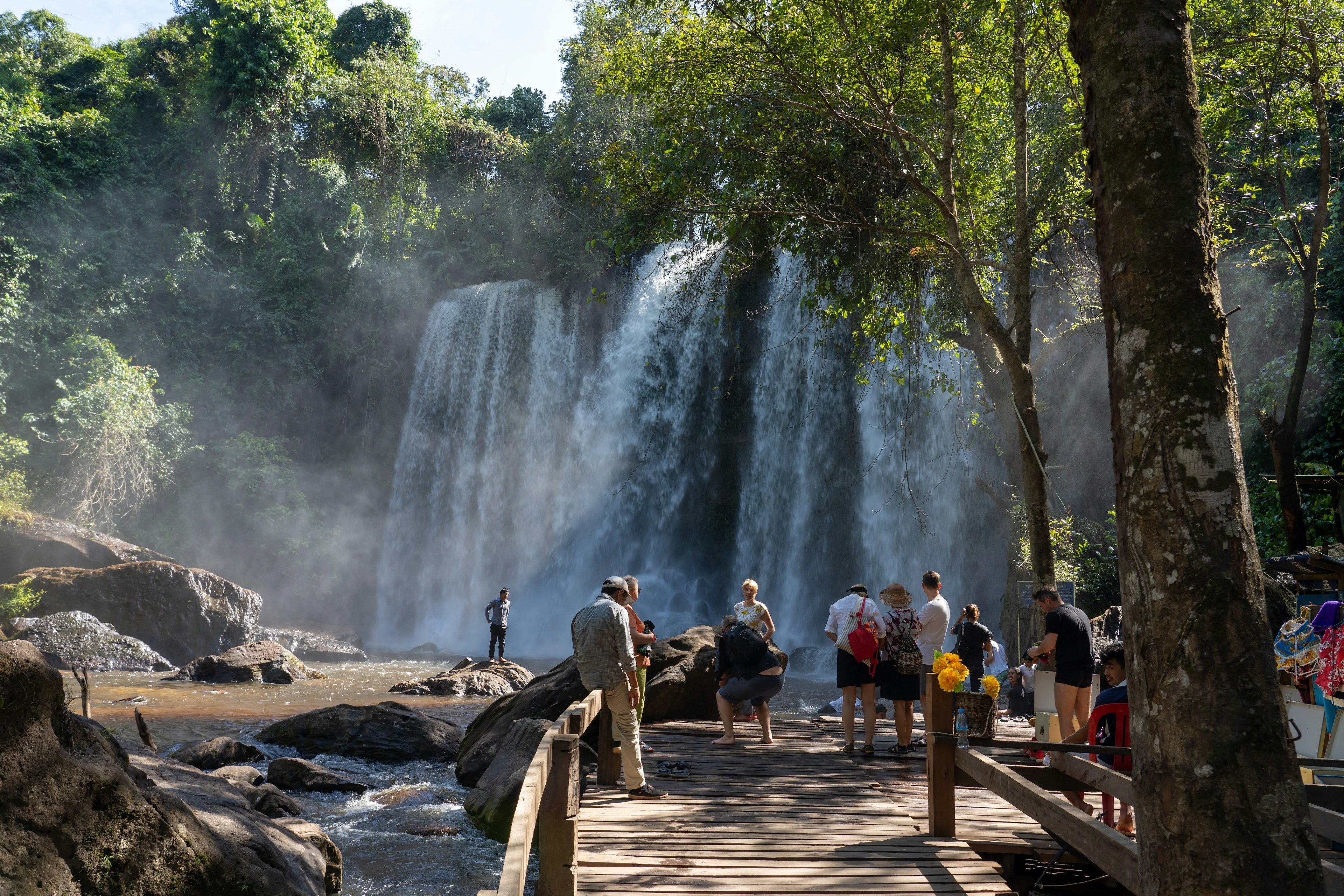 Tourists at the Phnom Kulen Waterfall near Angkor, Cambodia.