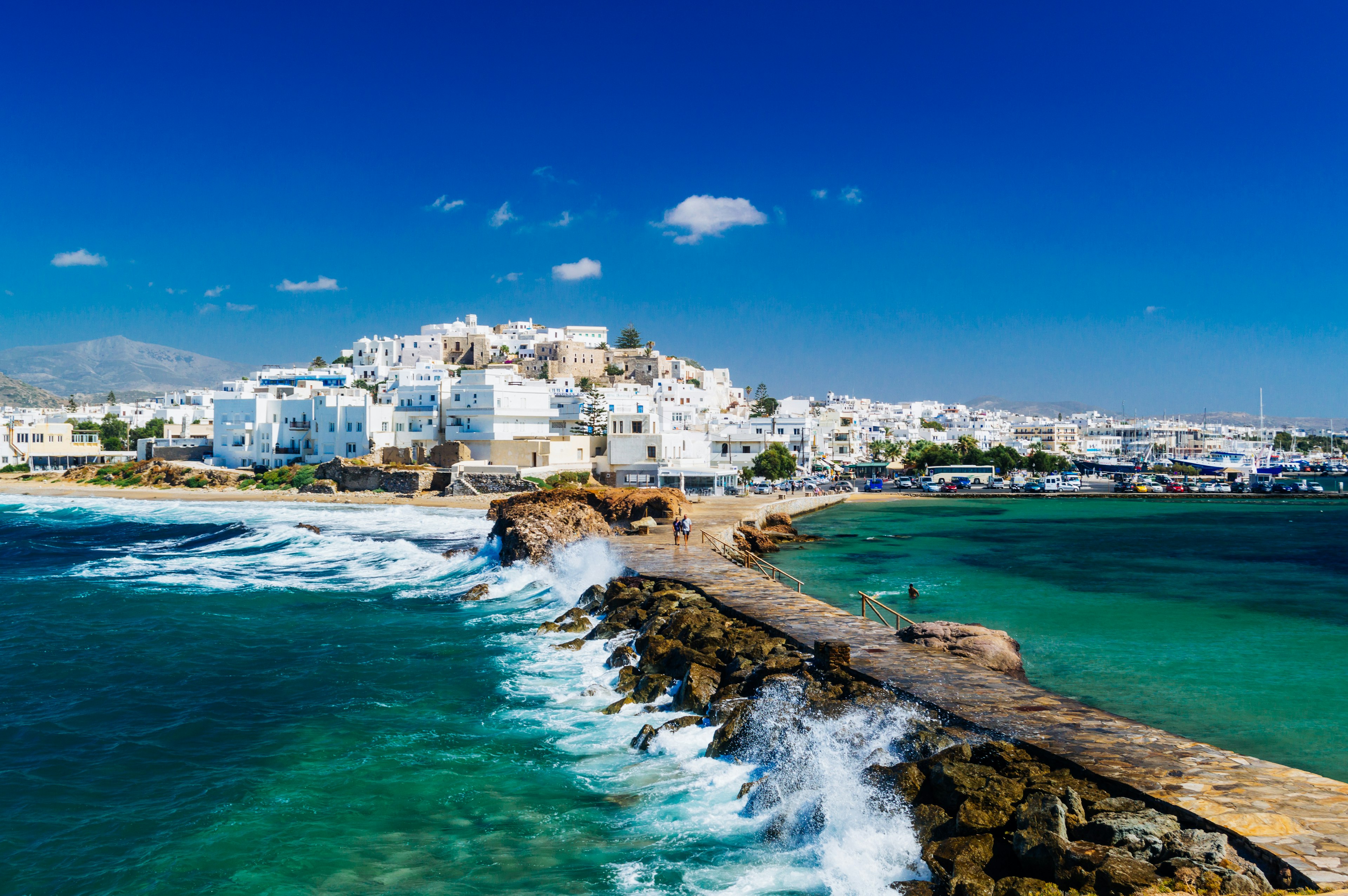 View of Naxos town and breaking waves, Cyclades archipelago, Greece.