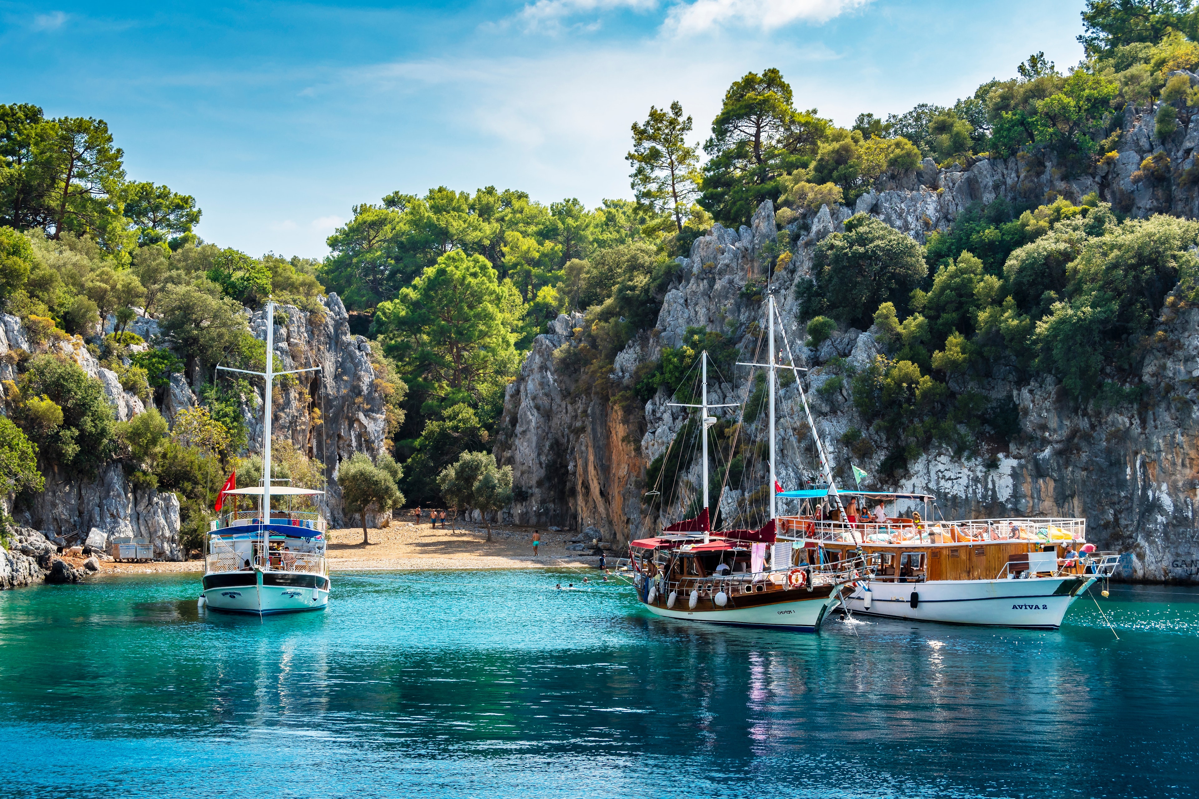 People relaxing on cruise boats in the Gocek Gulf in Turkey.