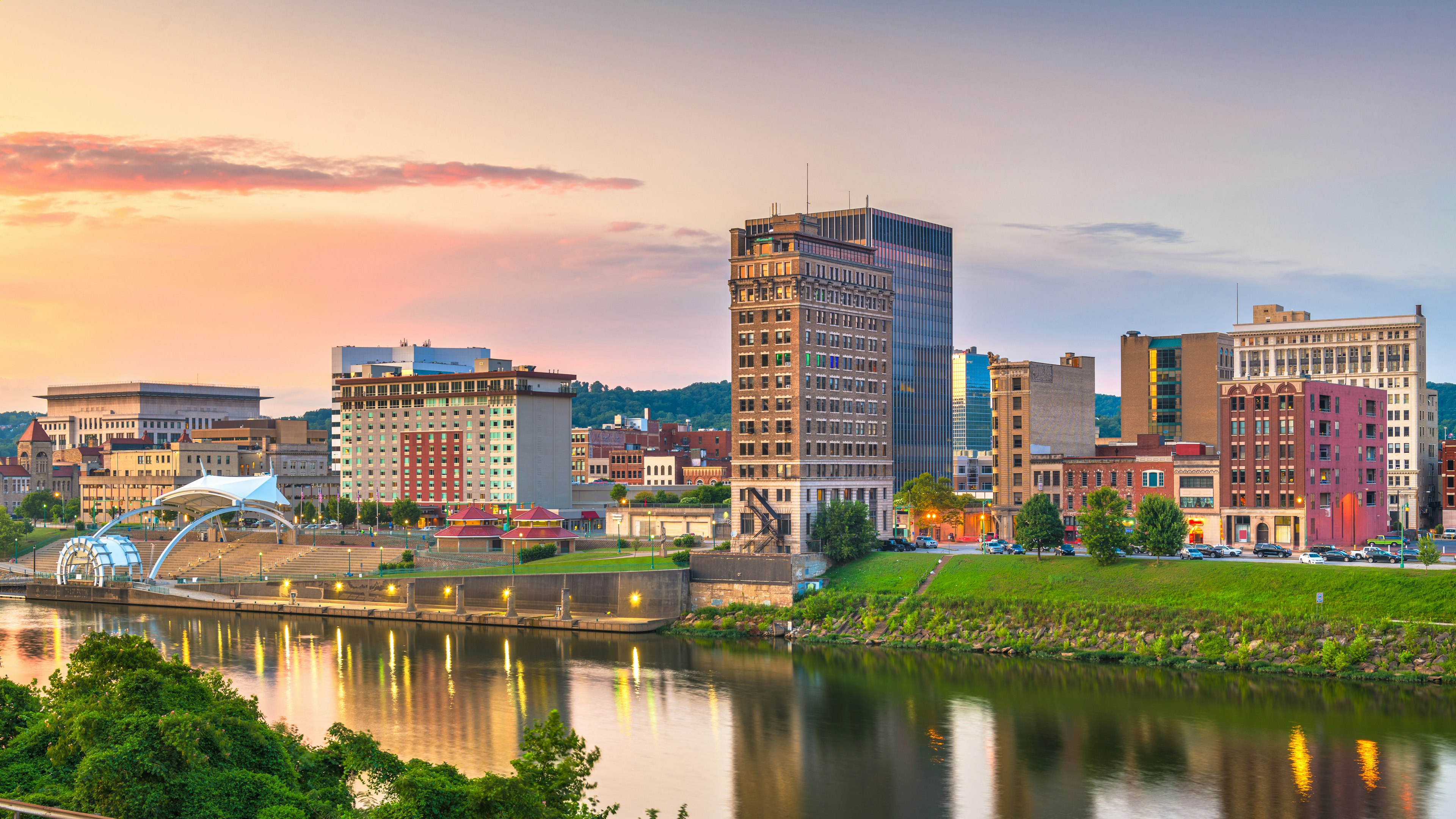 Charleston, West Virginia, USA downtown skyline on the river at dusk.