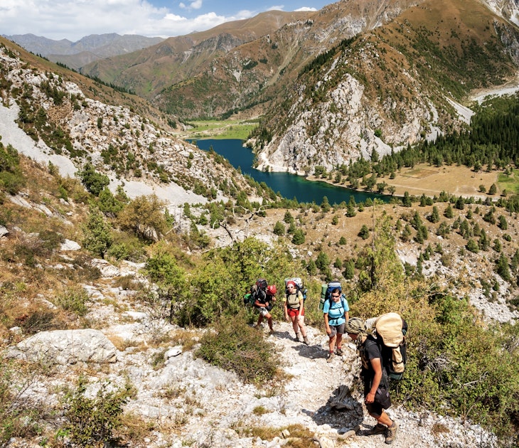 Group of young hikers trekking in mountains. Two women two men backpacking in summer near Sary Chelek lake, Sary-Chelek Jalal Abad region, Kyrgyzstan, Trekking in Central Asia.; Shutterstock ID 1853440510; purchase_order: 65050 - Digital Destinations and Articles; job: Lonely Planet Online Editorial; client: Trekking in Kyrgyzstan; other: Brian Healy
1853440510
adventure, alpine, asia, background, backpacker, beautiful, blue, bright, cloud, extreme, forest, general, green, hike, hiker, hiking, kyrgyzstan, lake, landscape, mountain, mountains, nature, noon, outdoor, outdoors, path, peak, people, picture, reflection, ridge, rock, sary-chelek, scenic, sky, sport, spring, summer, tourism, tourist, trail, travel, tree, trekker, trekking, view, water, woman
Group of young hikers trekking in mountains. Two women two men backpacking in summer near Sary Chelek lake, Sary-Chelek Jalal Abad region, Kyrgyzstan, Trekking in Central Asia